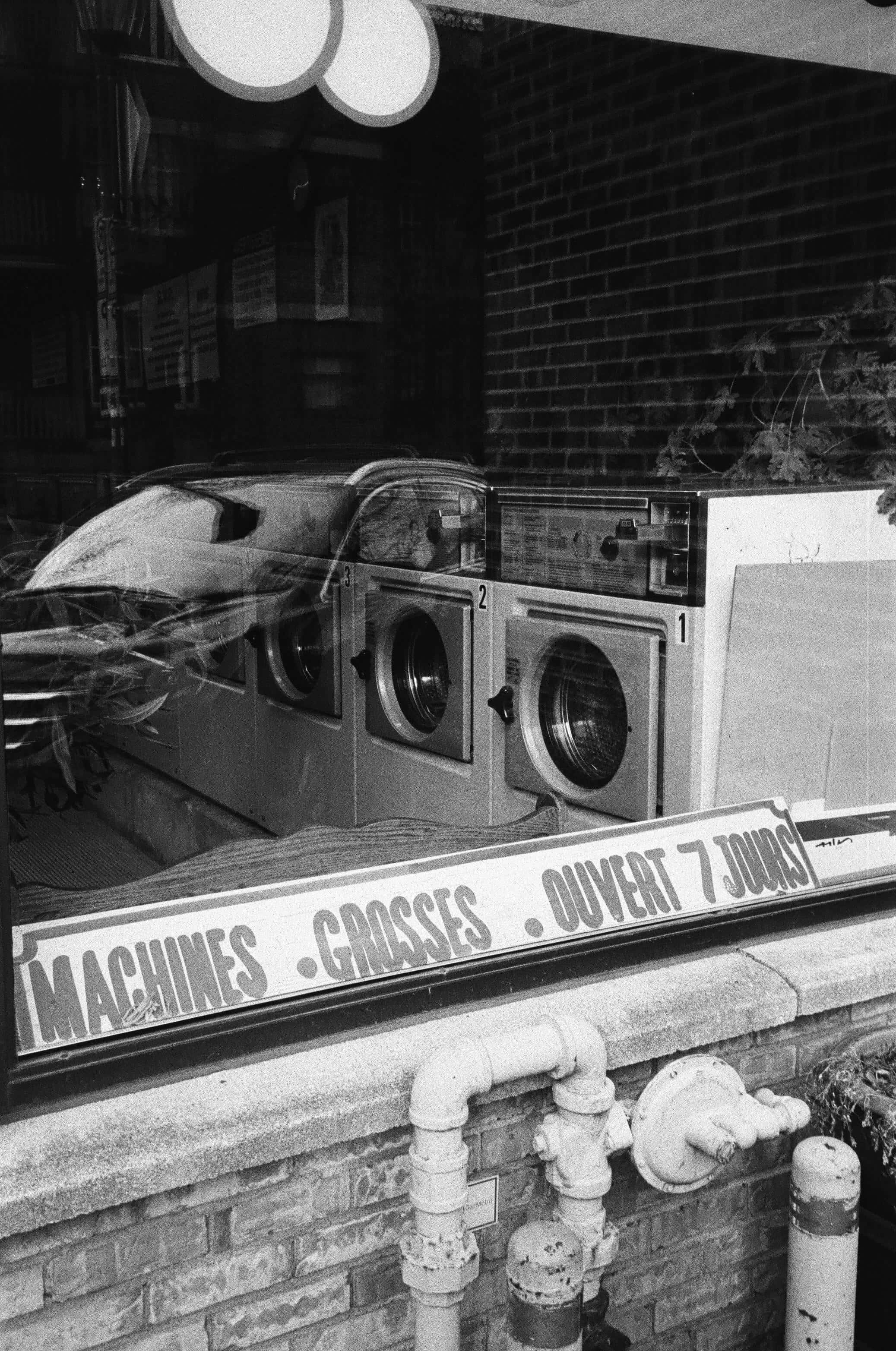 vintage washing machines, laundromat window, brick wall, 2K Phone Wallpaper