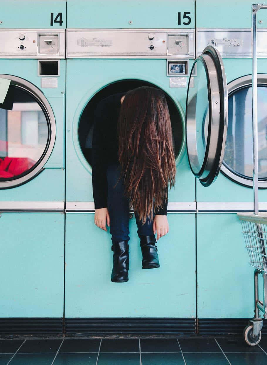 teal laundromat washer, long brown hair, quiet moment of solitude, SD Phone Wallpaper