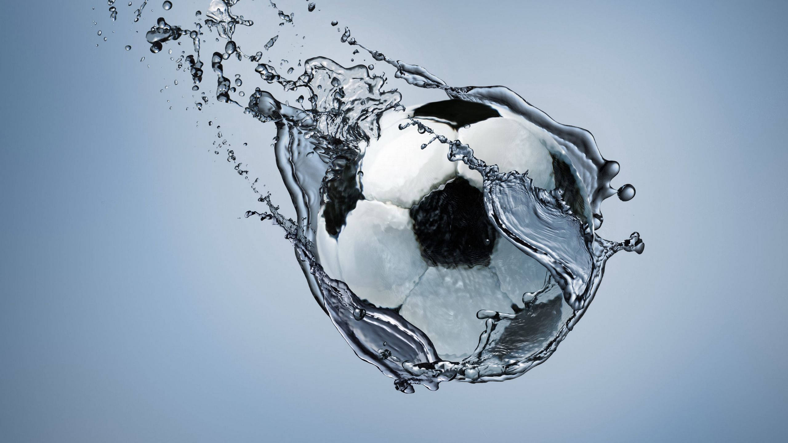 black and white soccer ball, clear water, dynamic splashes, 2K Desktop Wallpaper