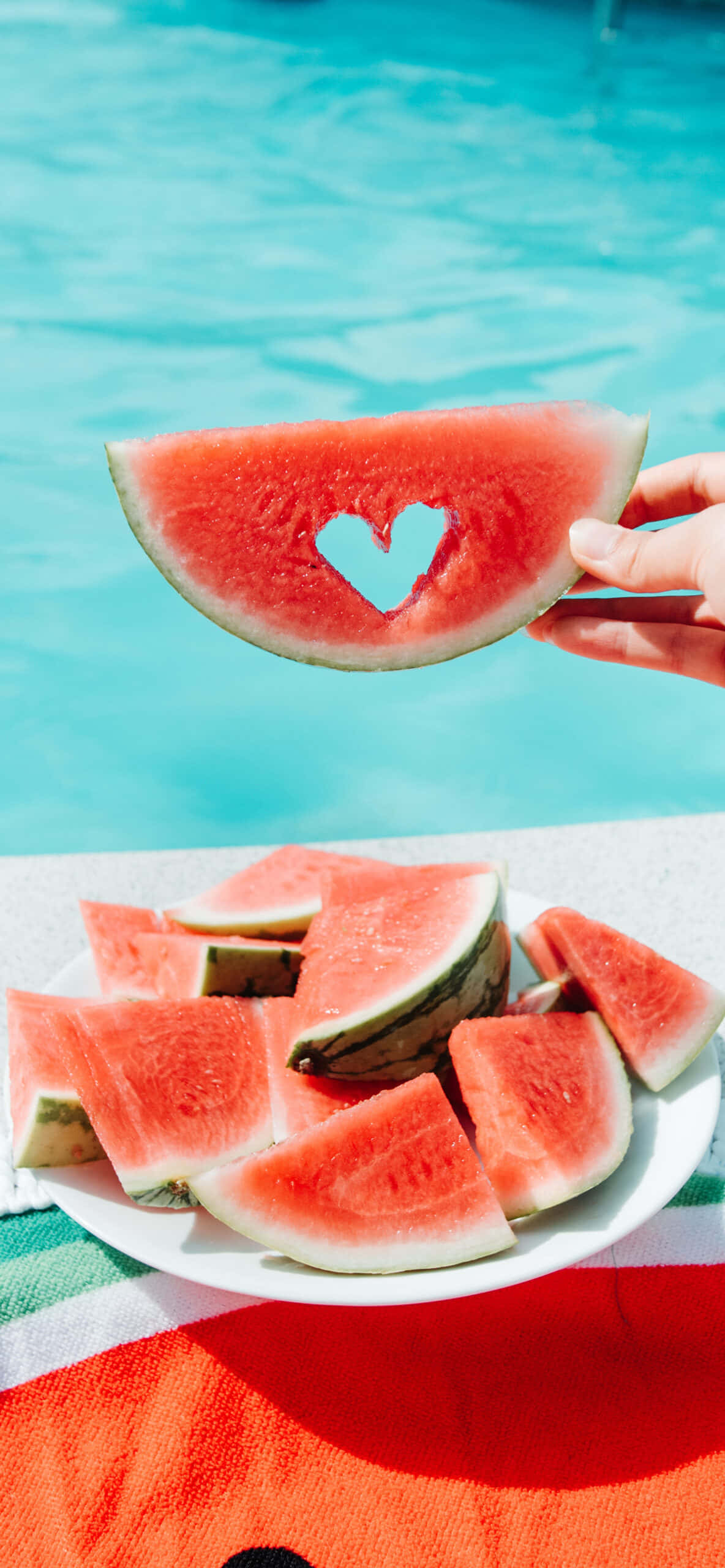 watermelon slice, heart-shaped hole, turquoise pool, 2K Phone Wallpaper