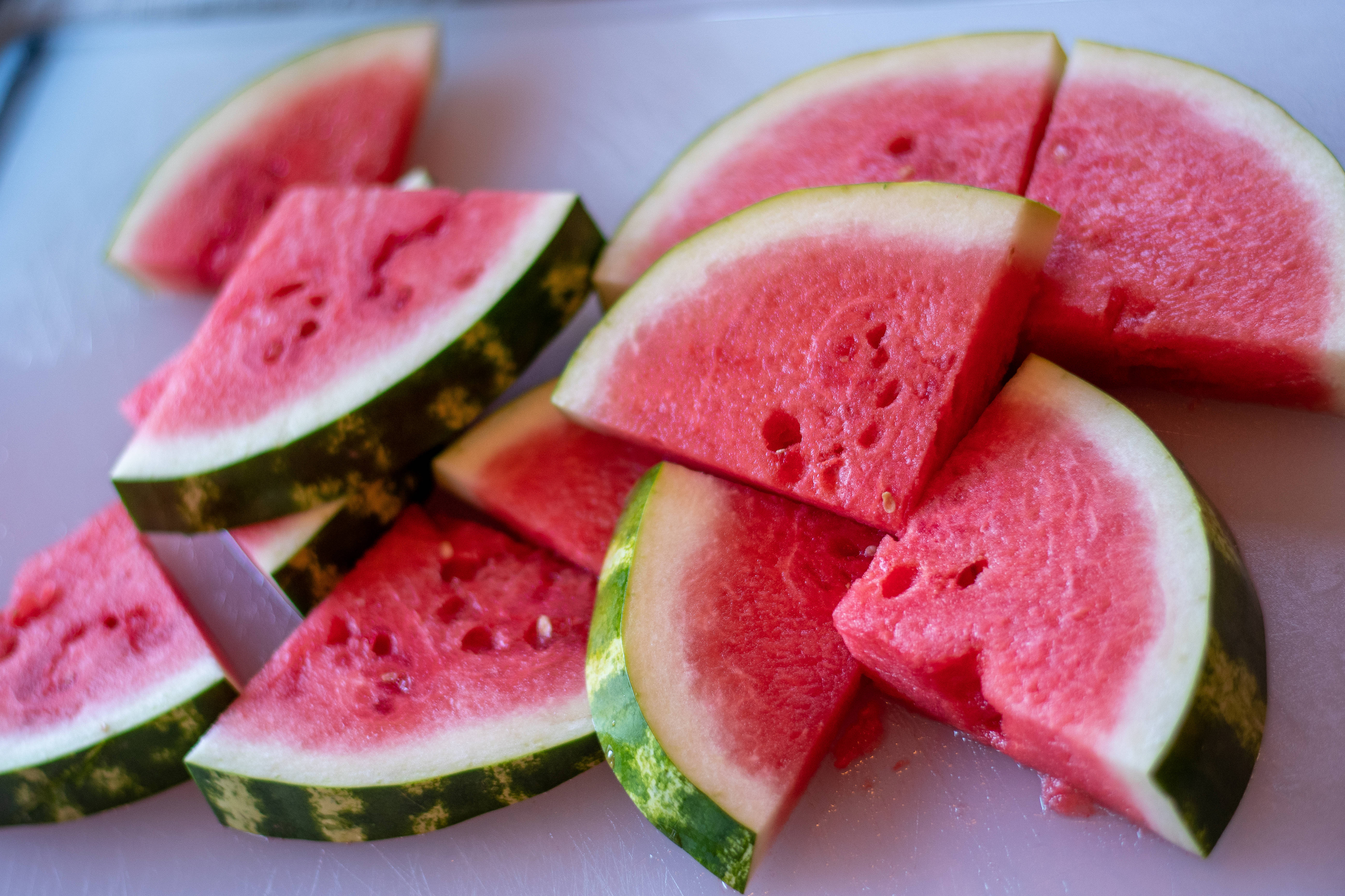 tiny watermelon slices, vibrant pink flesh, green rind, 5K Desktop Wallpaper