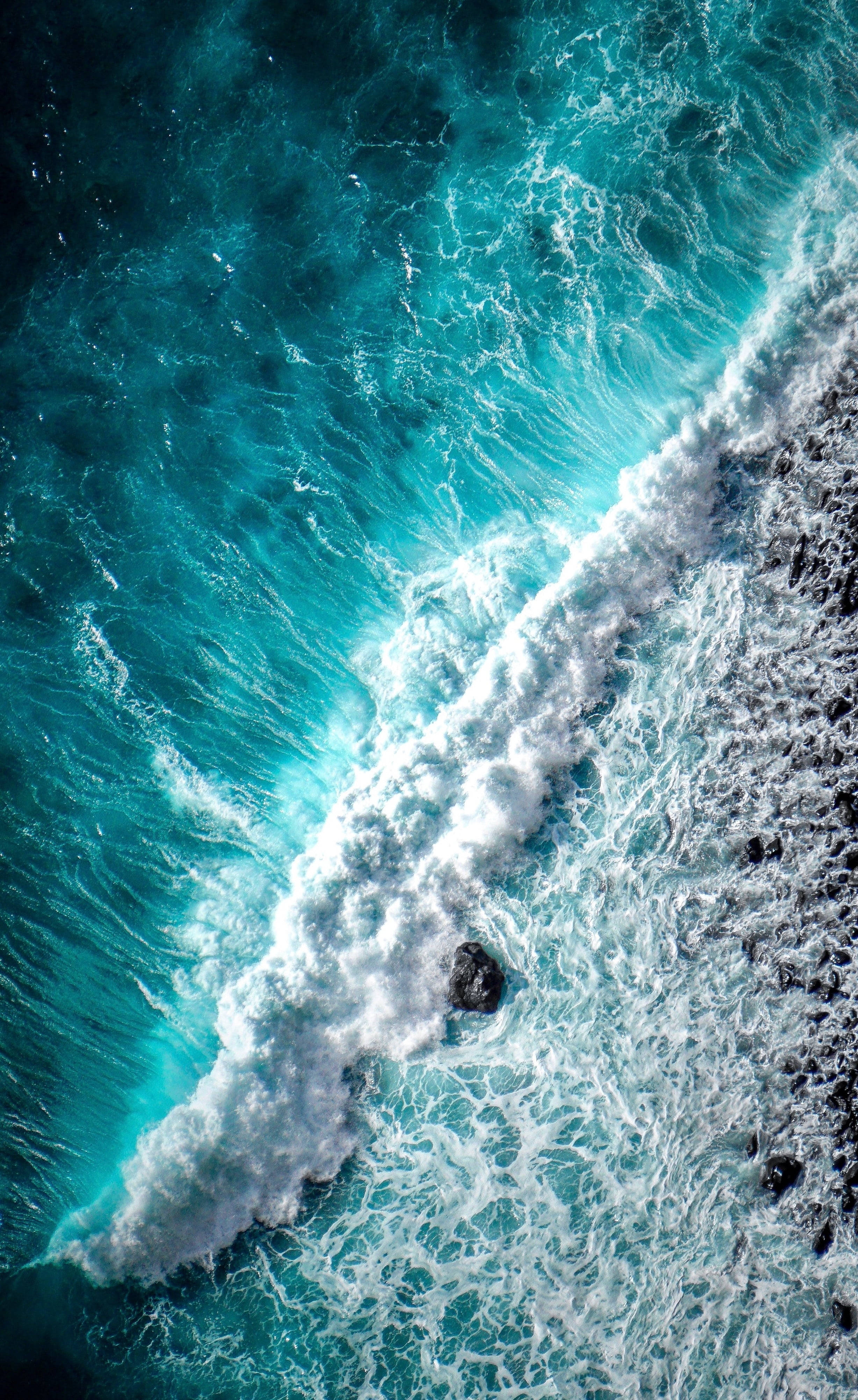 beach wave, turquoise ocean, dark volcanic rocks, 4K Phone Wallpaper
