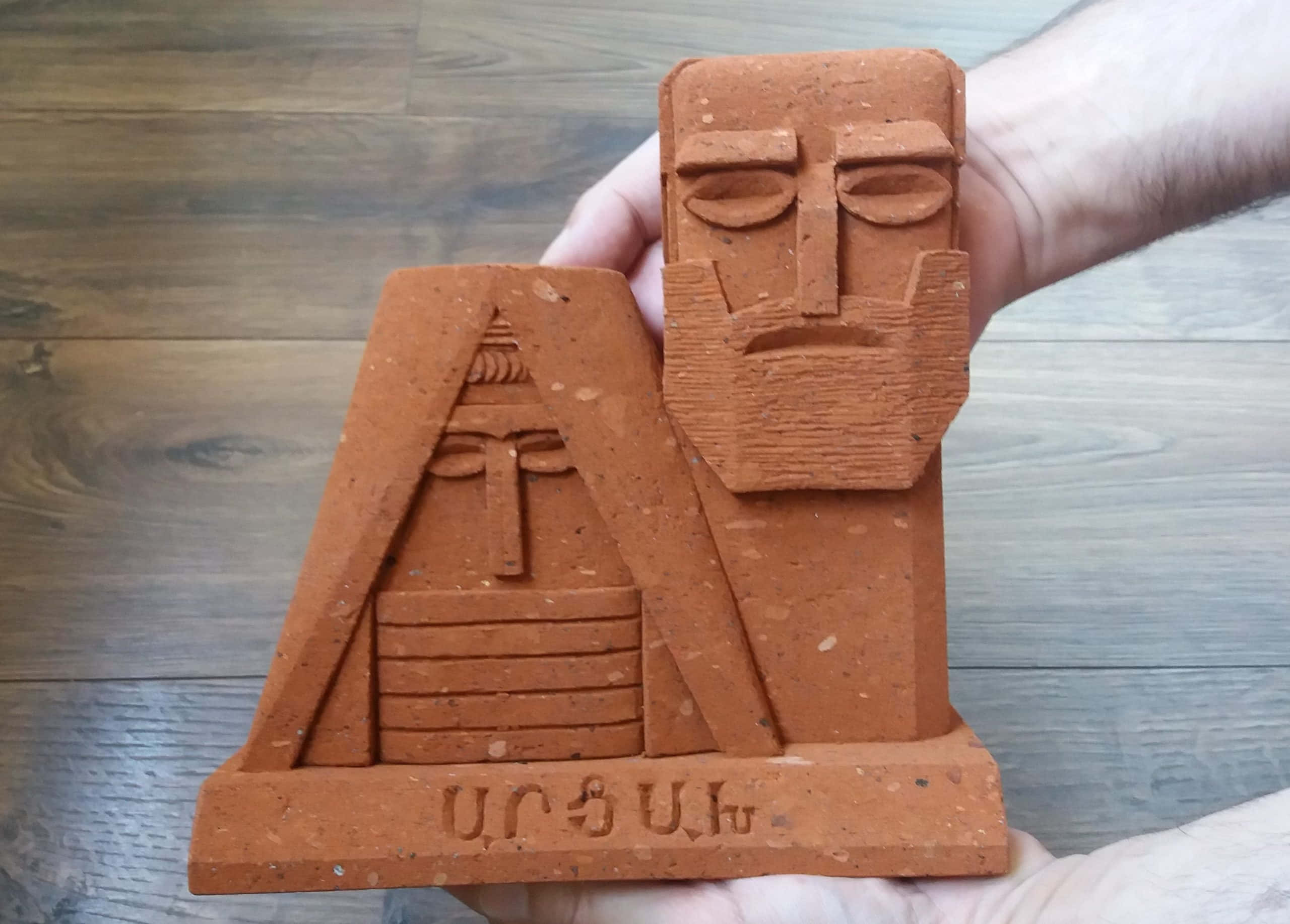 We Are Our Mountains, terracotta sculpture, stylized bearded man, 2K Desktop Wallpaper