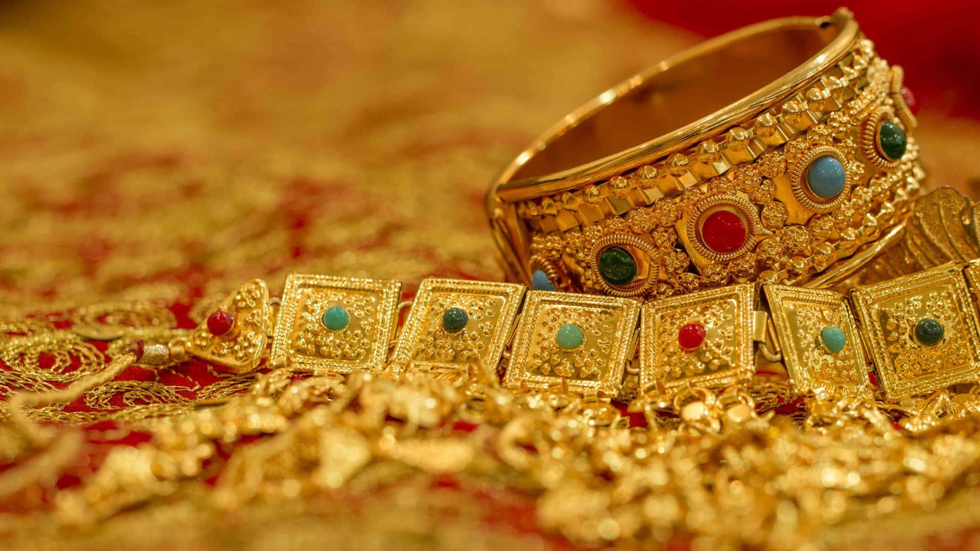 opulent gold jewelry, colorful gemstones, rich red and gold patterned fabric, Full HD Desktop Wallpaper