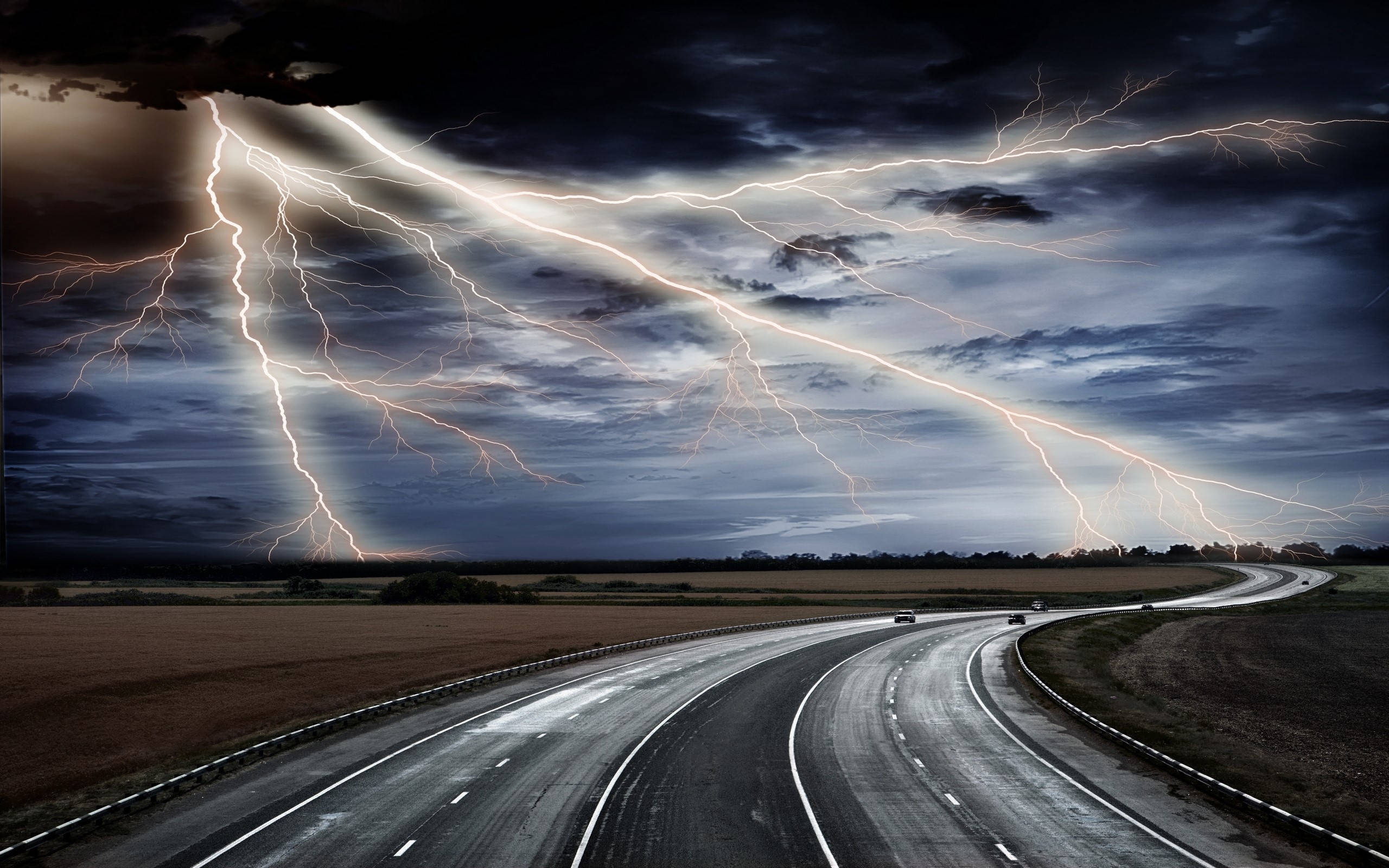 dark stormy weather, winding highway, dramatic sky, 2K Desktop Wallpaper