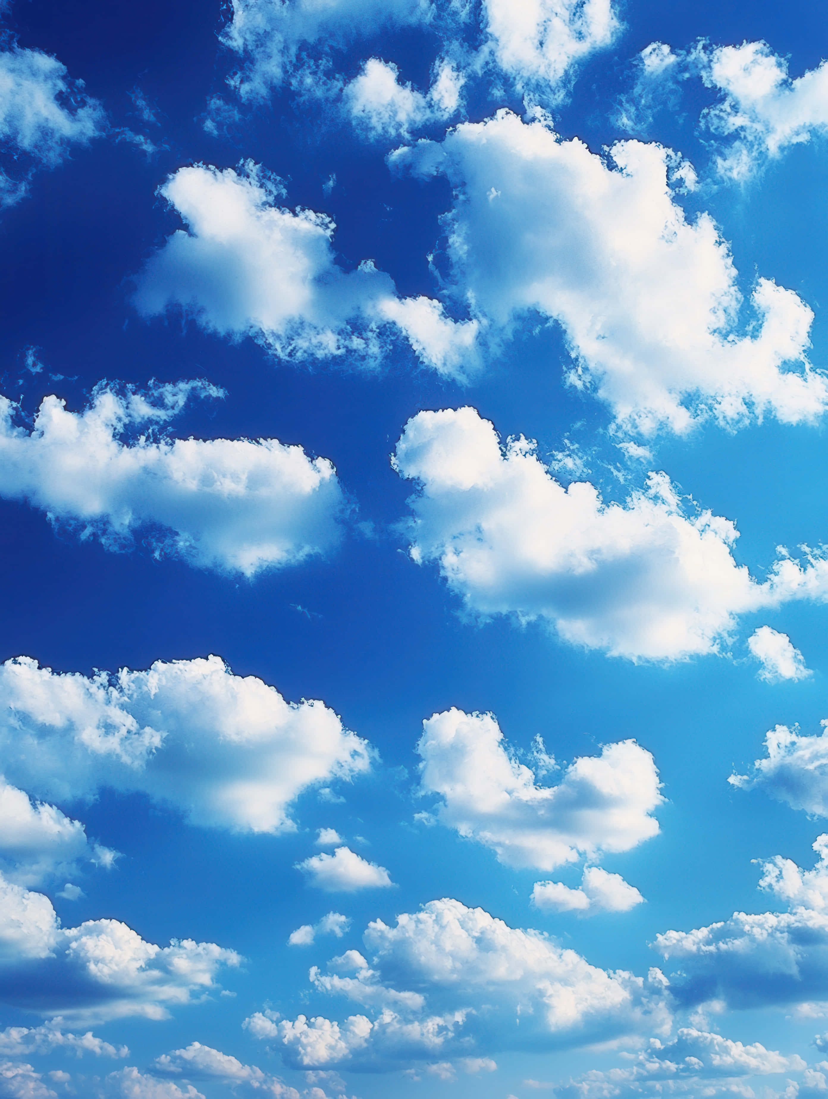 vibrant azure sky, fluffy white cumulus clouds, clear daytime horizon, 2K Phone Wallpaper