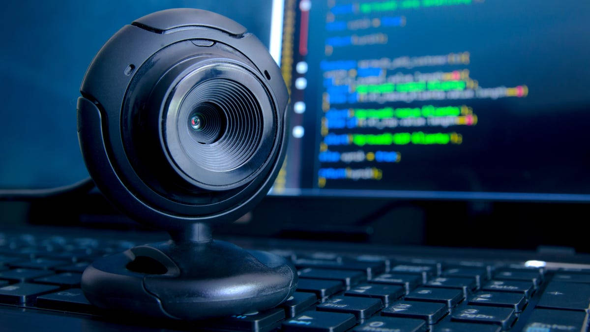 black webcam, keyboard, glowing code screen, SD Desktop Wallpaper