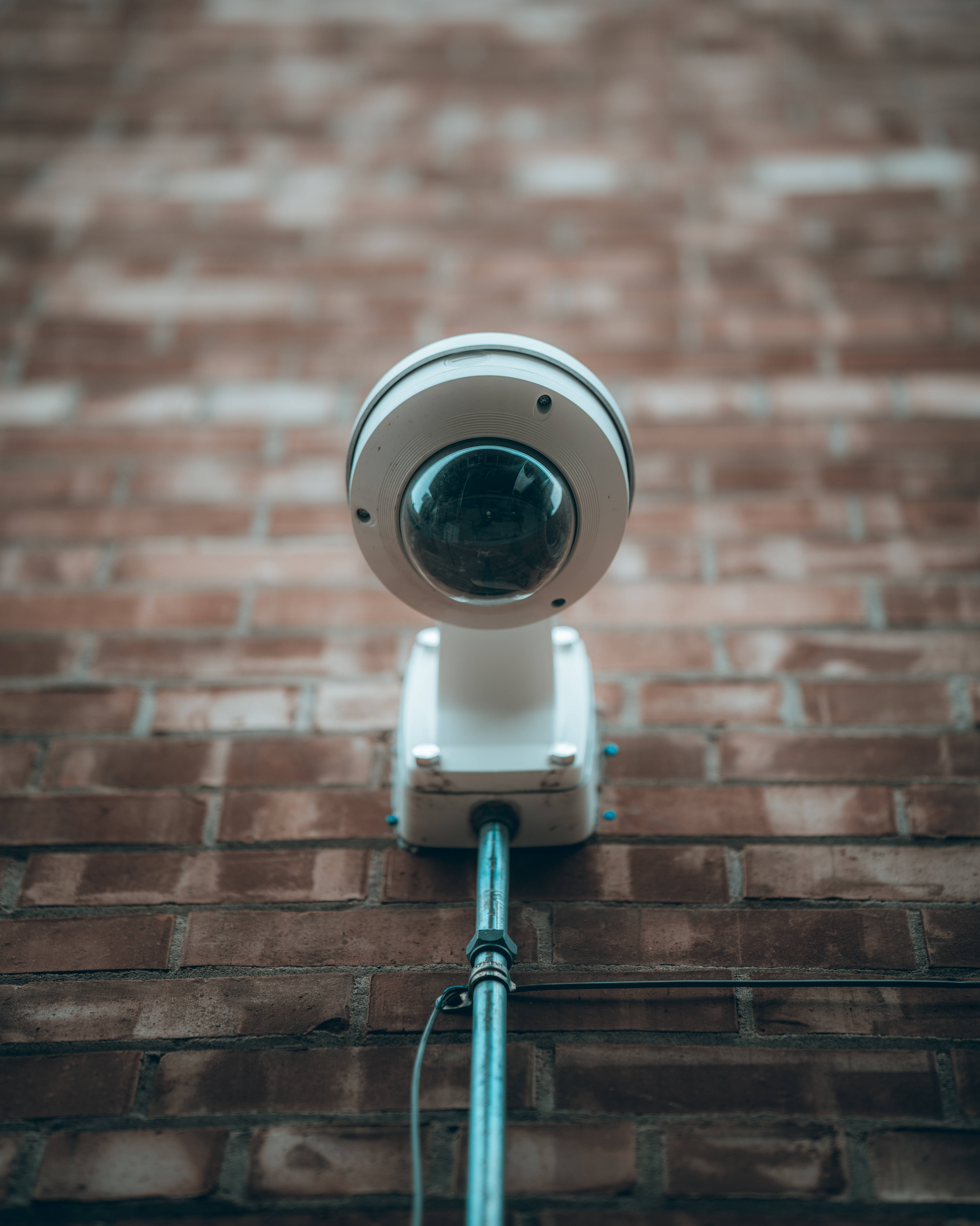 white dome security camera, brick wall, cable, 5K Phone Wallpaper