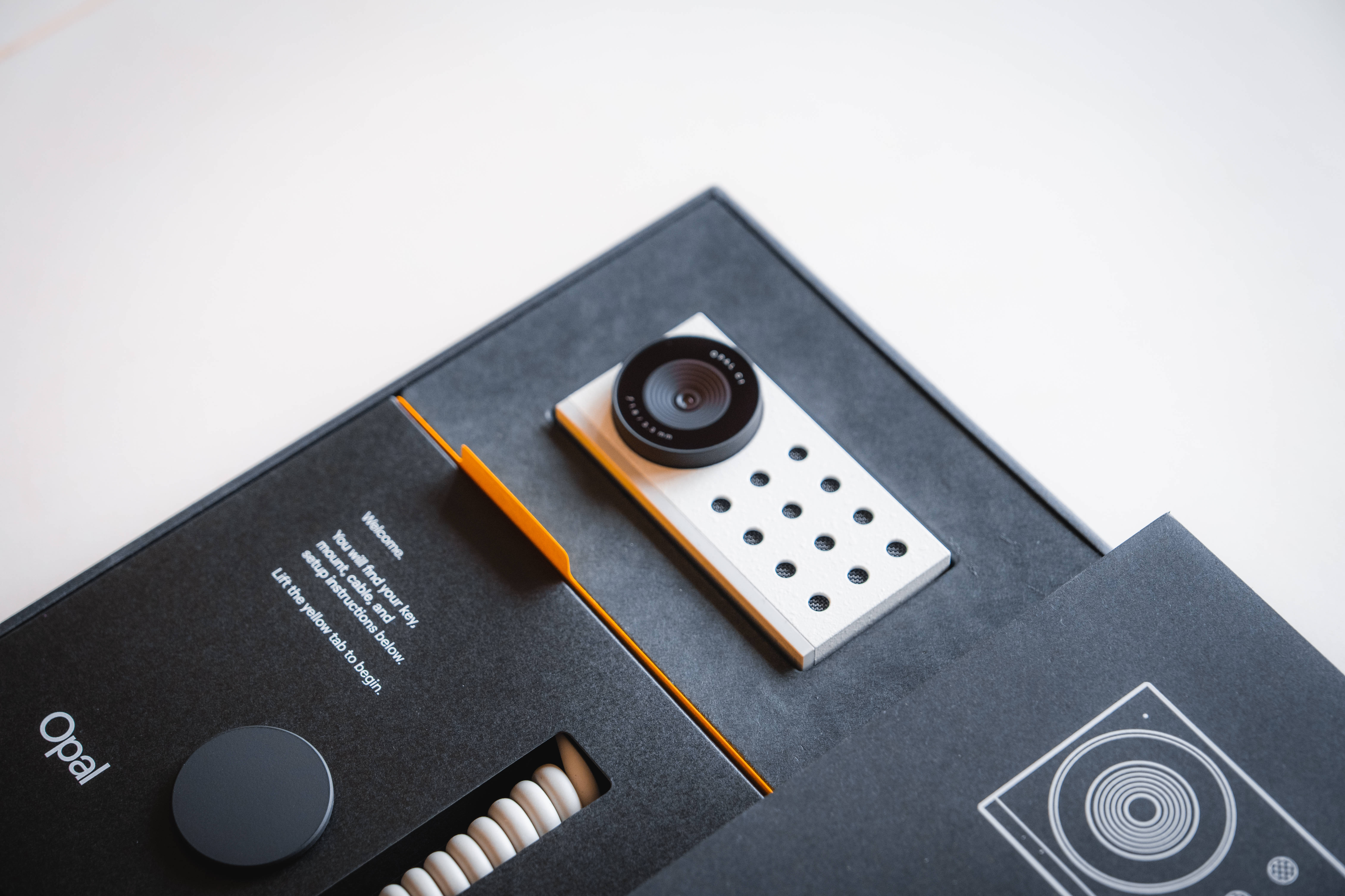black safe box, webcam, orange accents, 5K Desktop Wallpaper