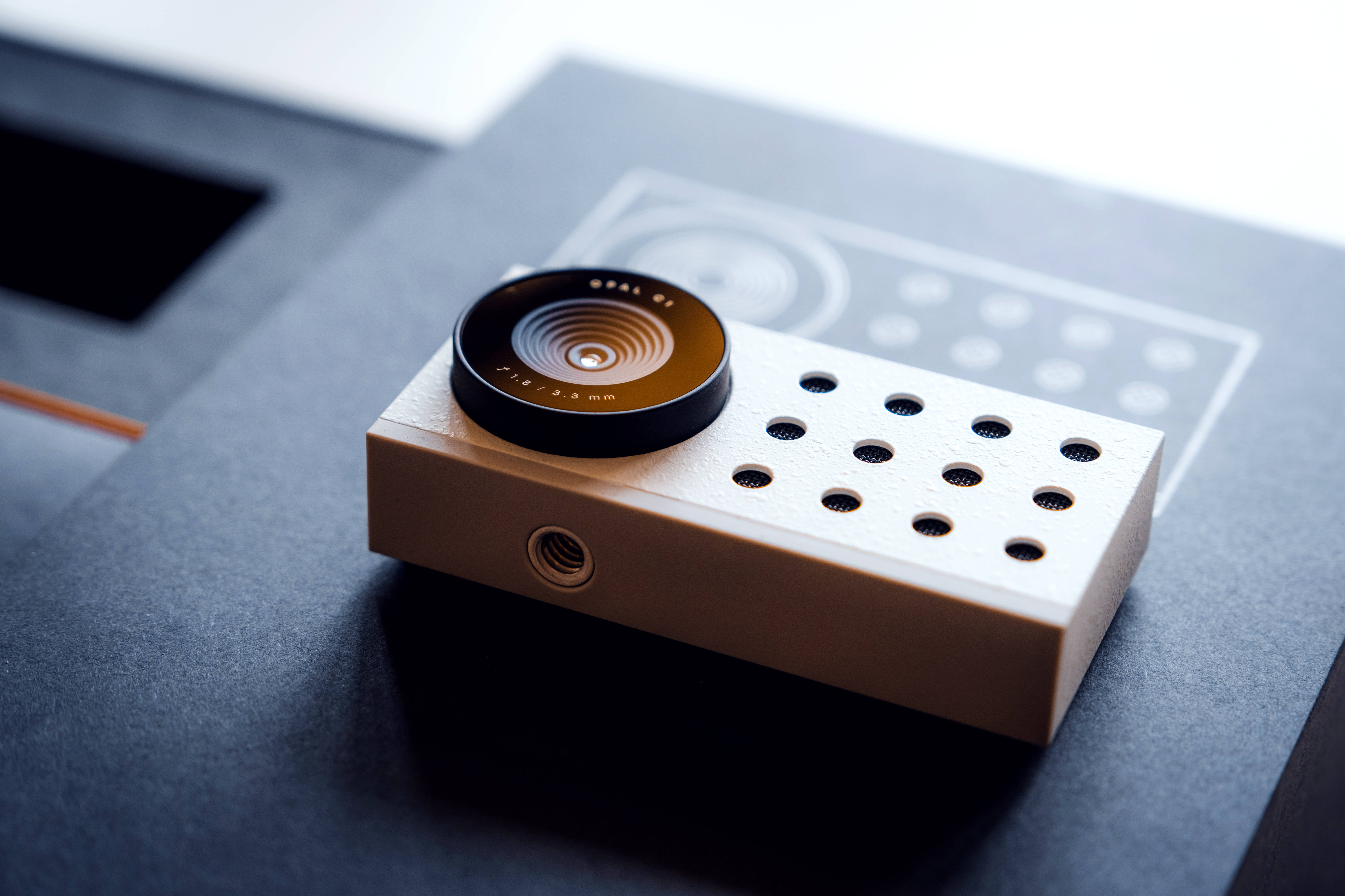 beige camera, black lens, dark gray surface, 5K Desktop Wallpaper