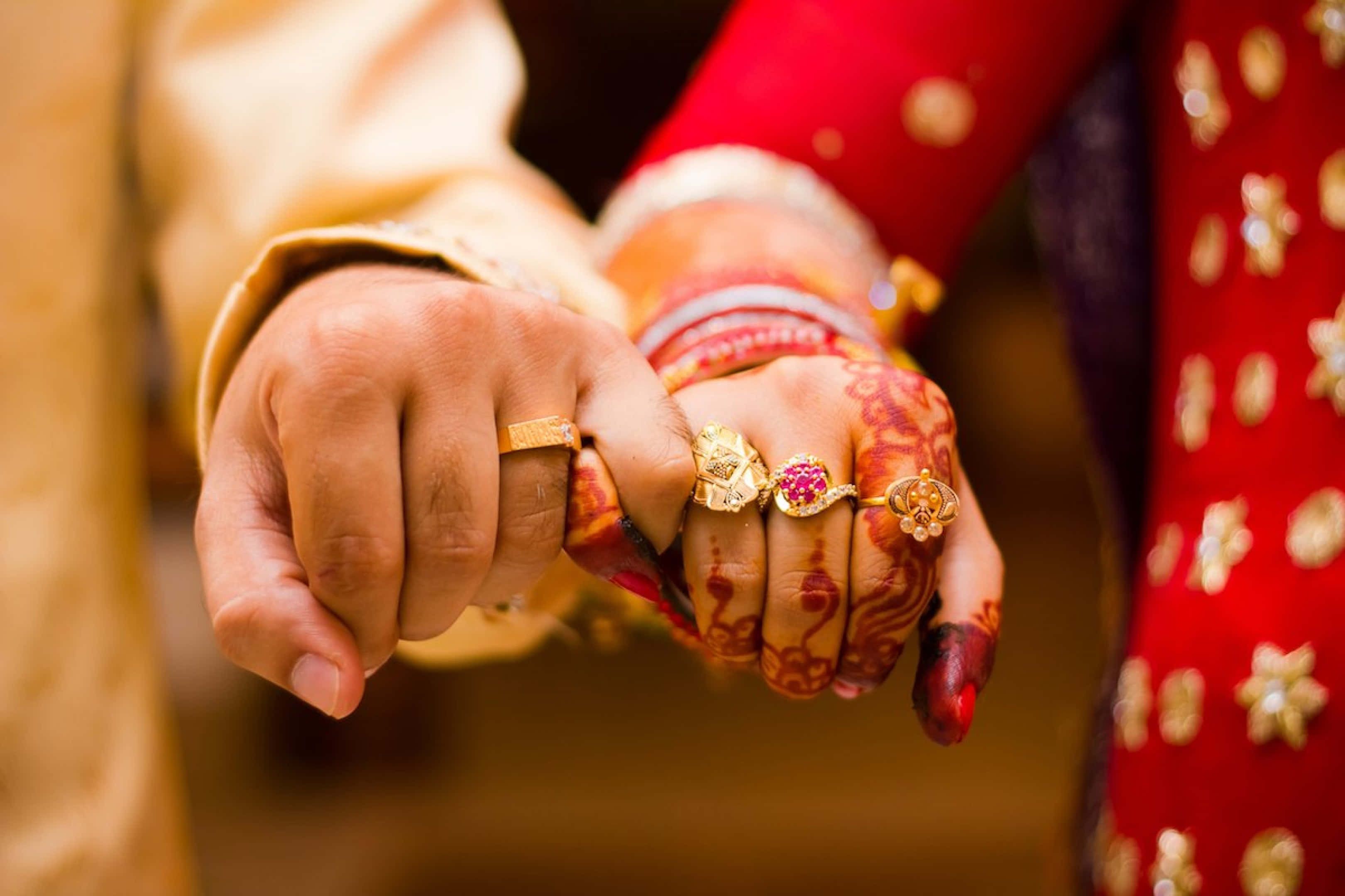 gold rings, red and gold traditional attire, intricate henna patterns, 2K Desktop Wallpaper