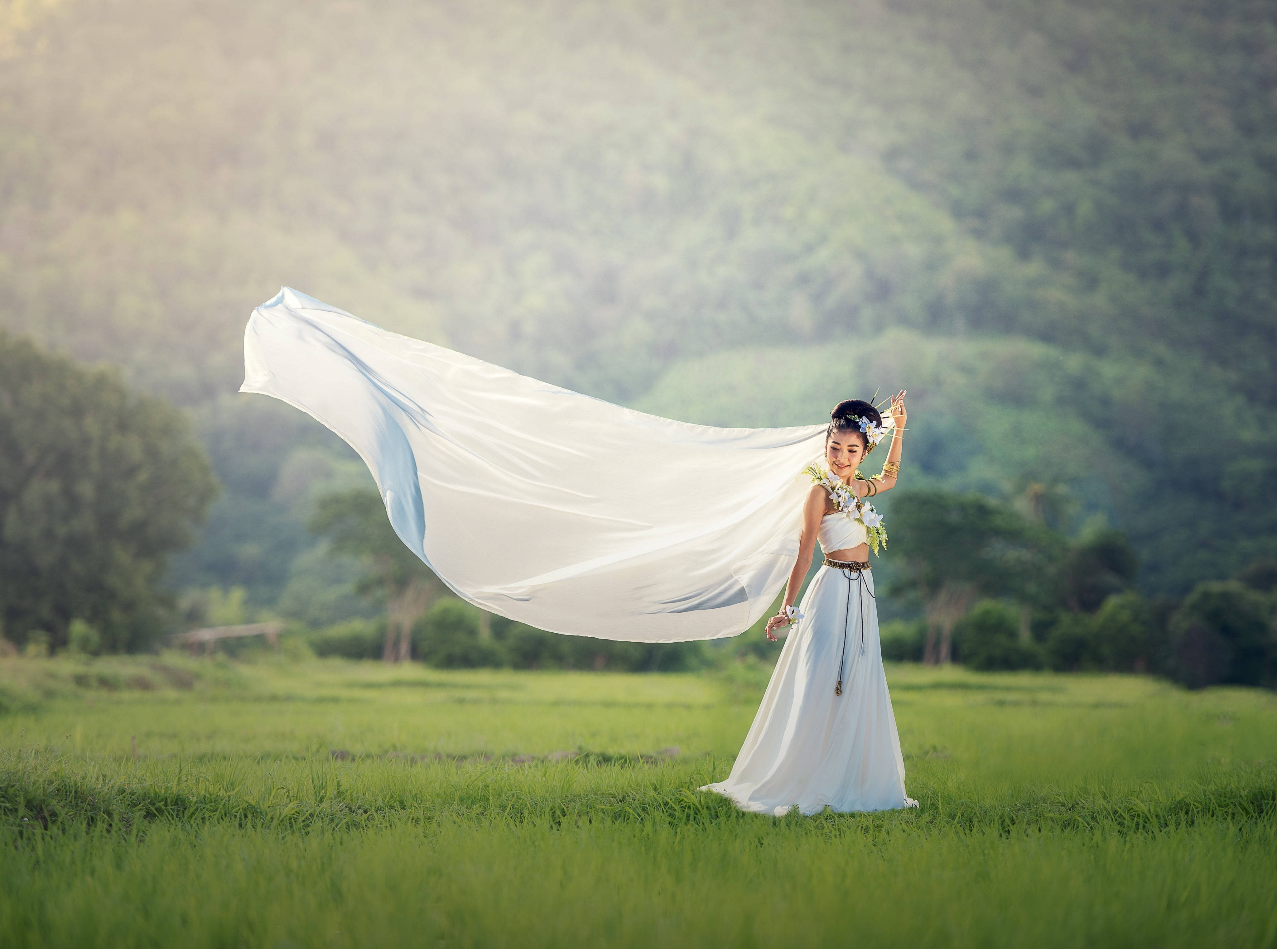white dress, sunlit green field, mountains, 4K Desktop Wallpaper