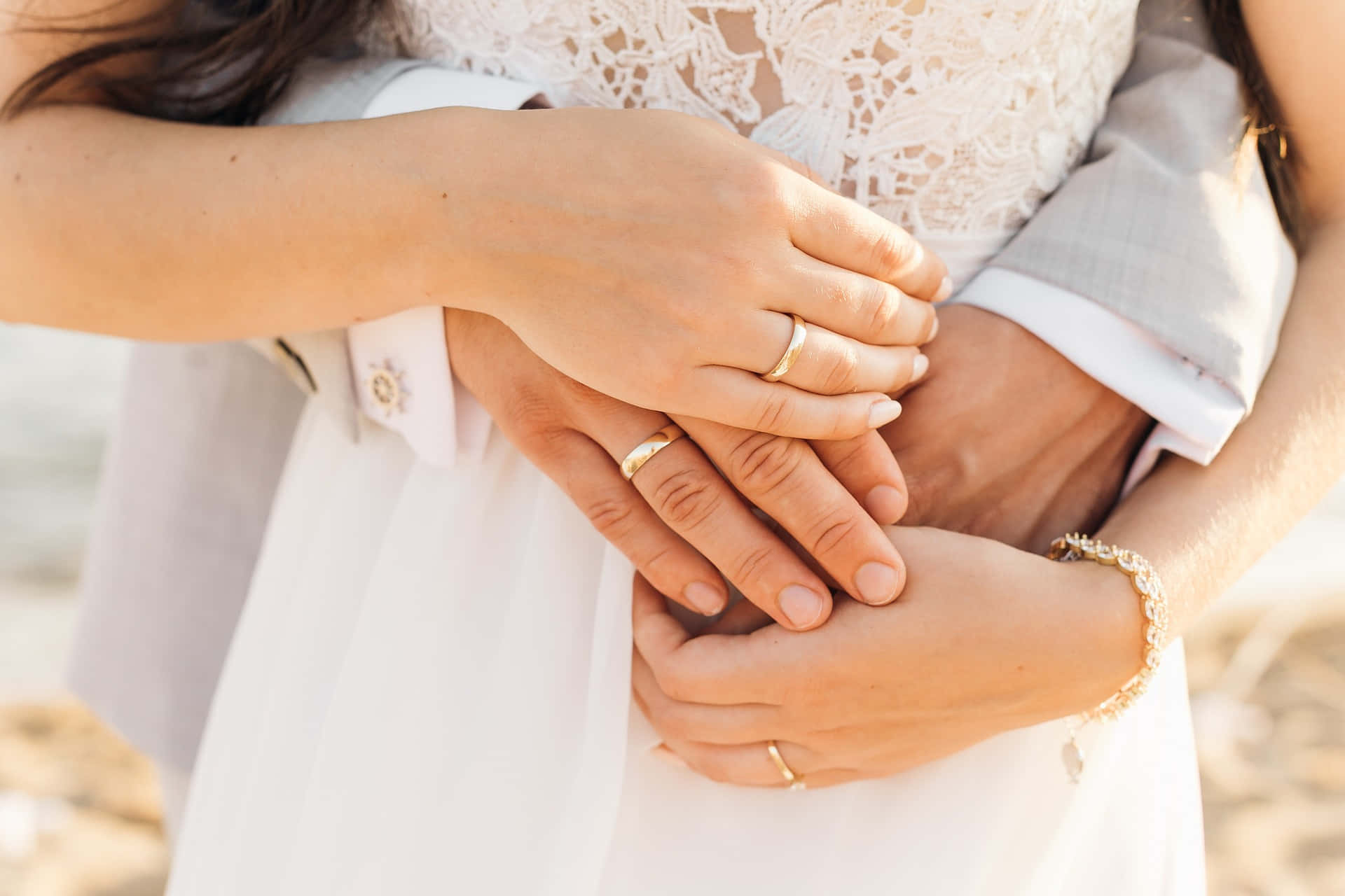 wedding rings, intertwined hands, soft golden sunlight, Full HD Desktop Wallpaper