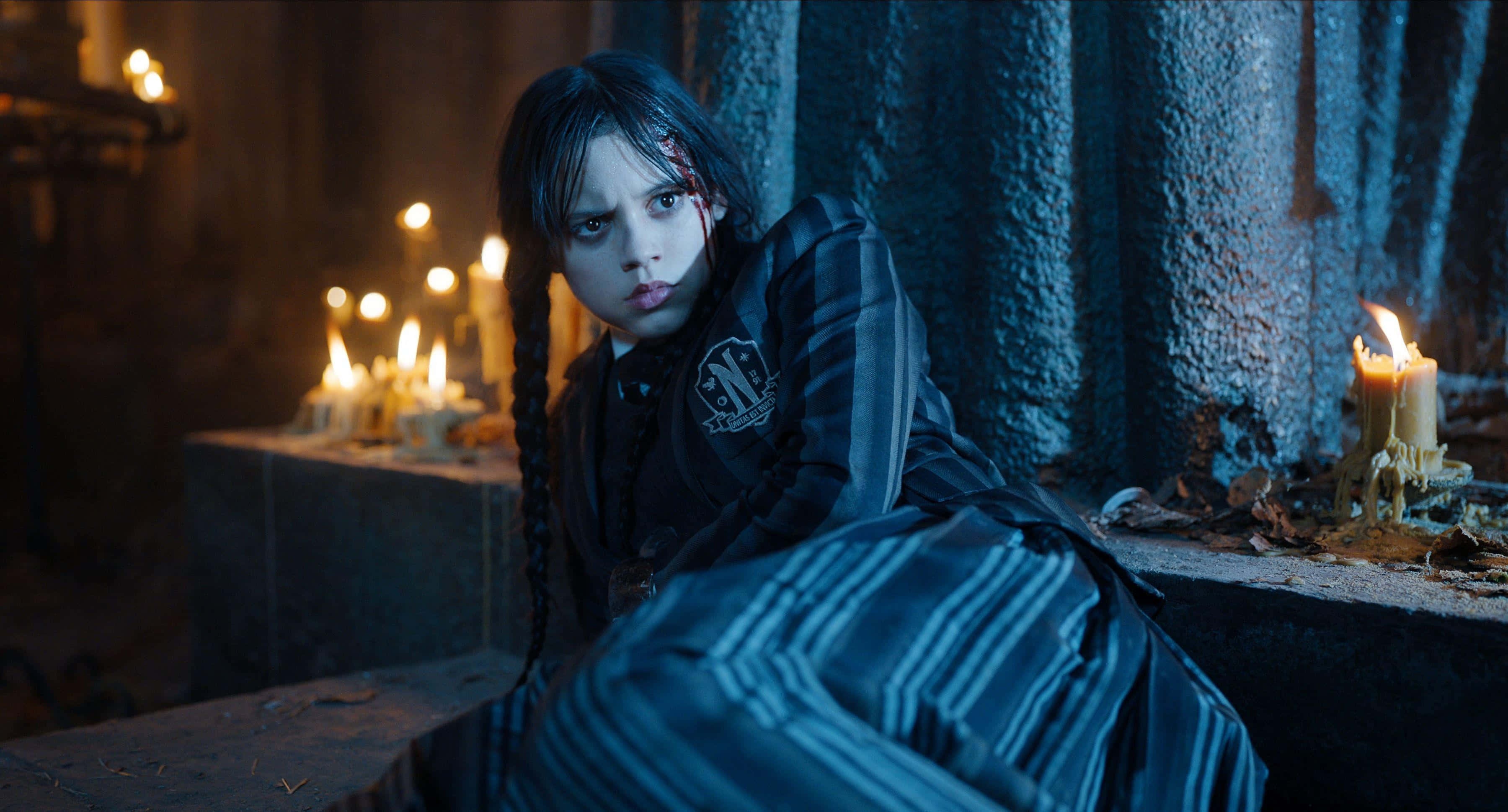 Wednesday Addams, striped dress, candlelit stone room, 2K Desktop Wallpaper