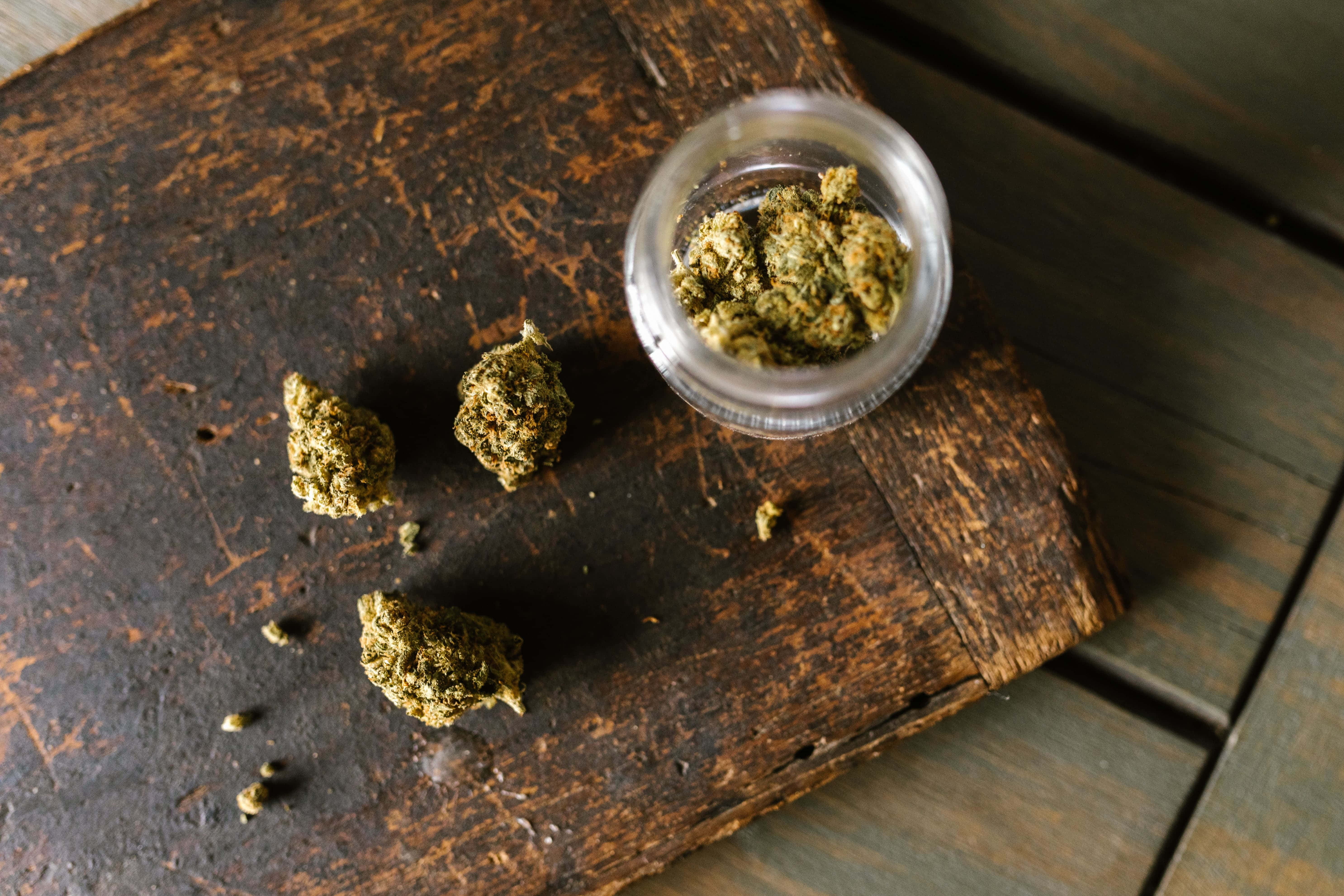 weed blunt, fresh green cannabis buds, weathered wooden surface, 5K Desktop Wallpaper