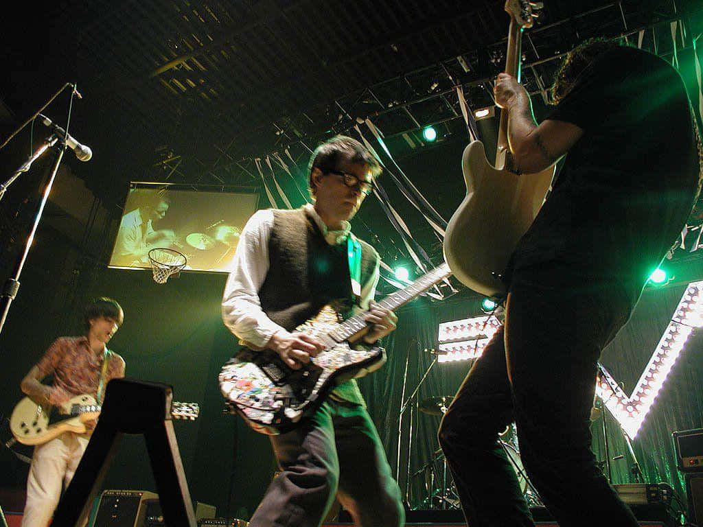 Weezer, live concert performance, green stage lights, SD Desktop Wallpaper