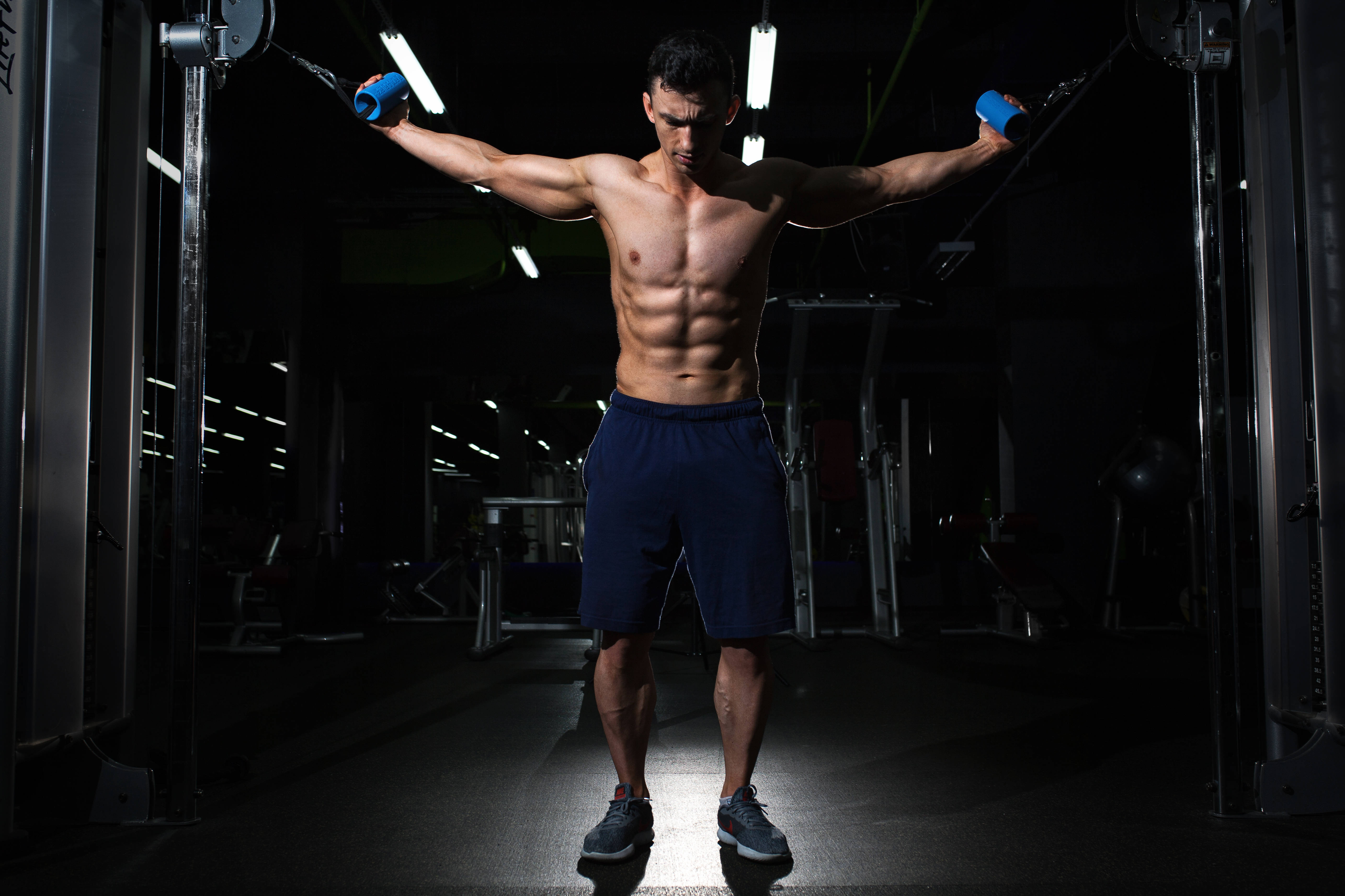 cable fly exercise, dimly lit gym, defined abs, 5K Desktop Wallpaper