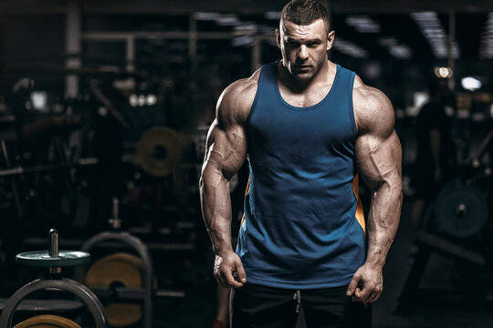 blue tank top, dimly lit gym, weight equipment, SD Desktop Wallpaper