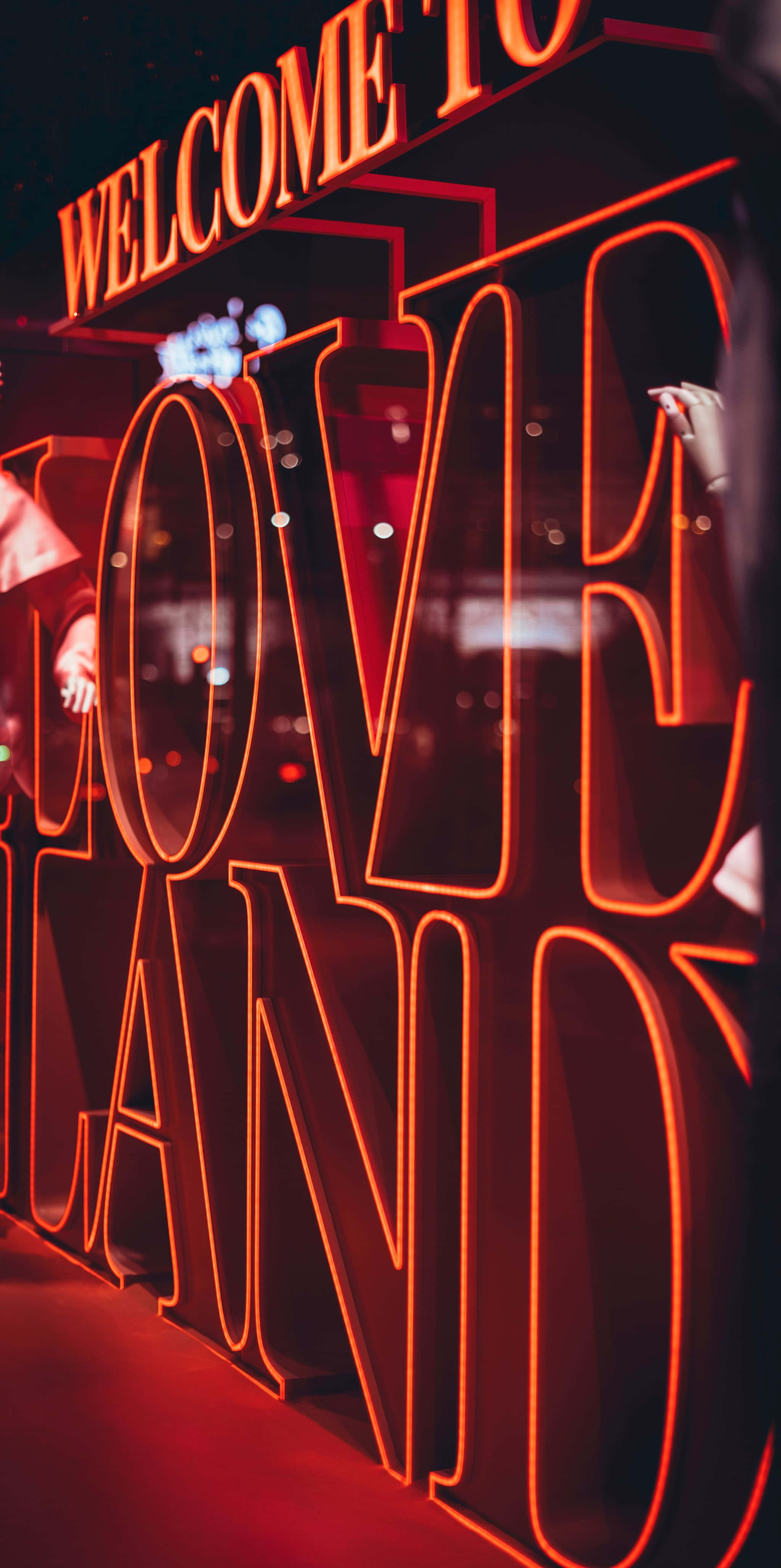 neon red aesthetic, WELCOME TO LOVE LAND, glowing red neon sign, 4K Phone Wallpaper