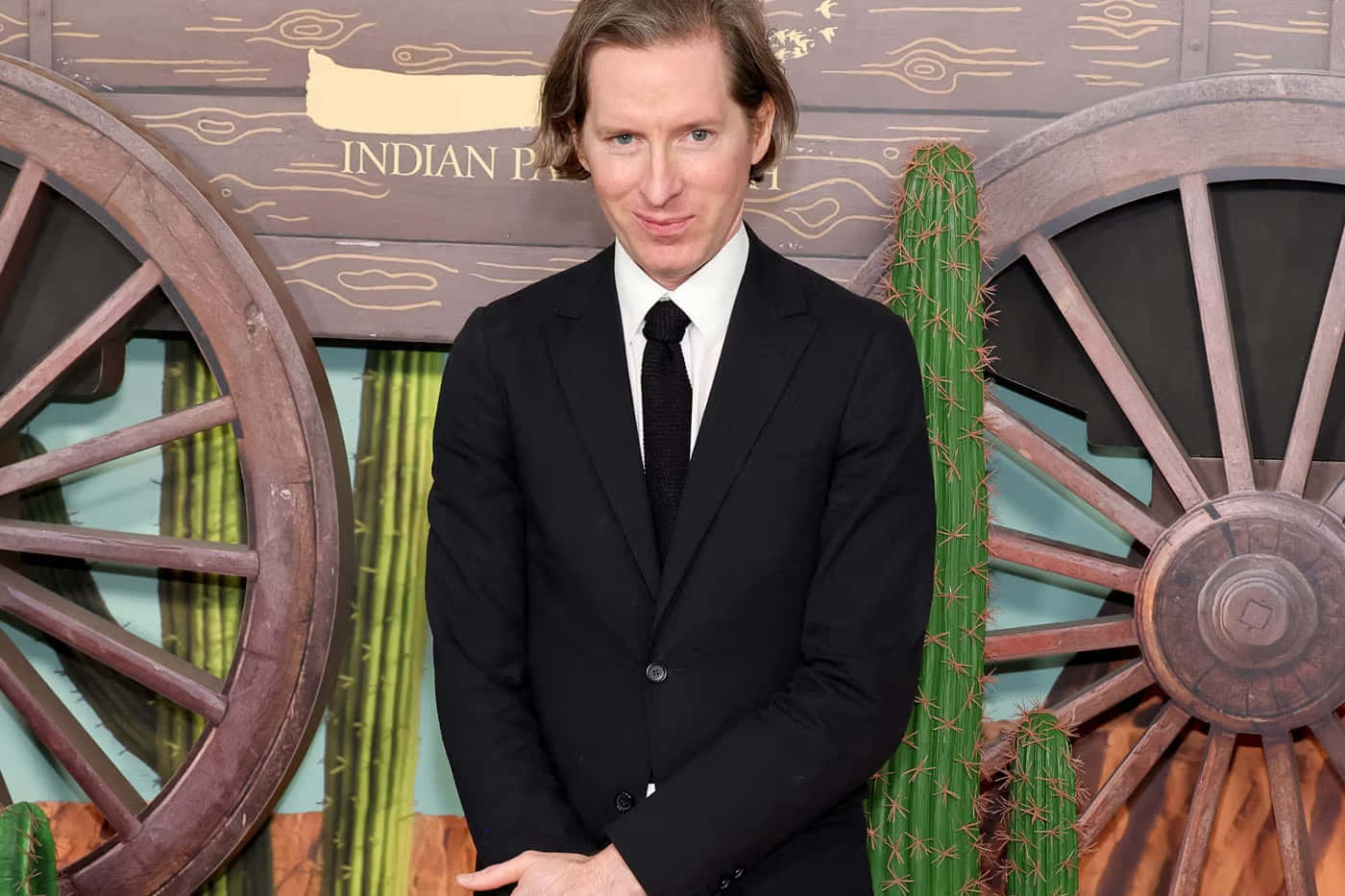 Wes Anderson, black suit, rustic western-themed backdrop, HD Desktop Wallpaper