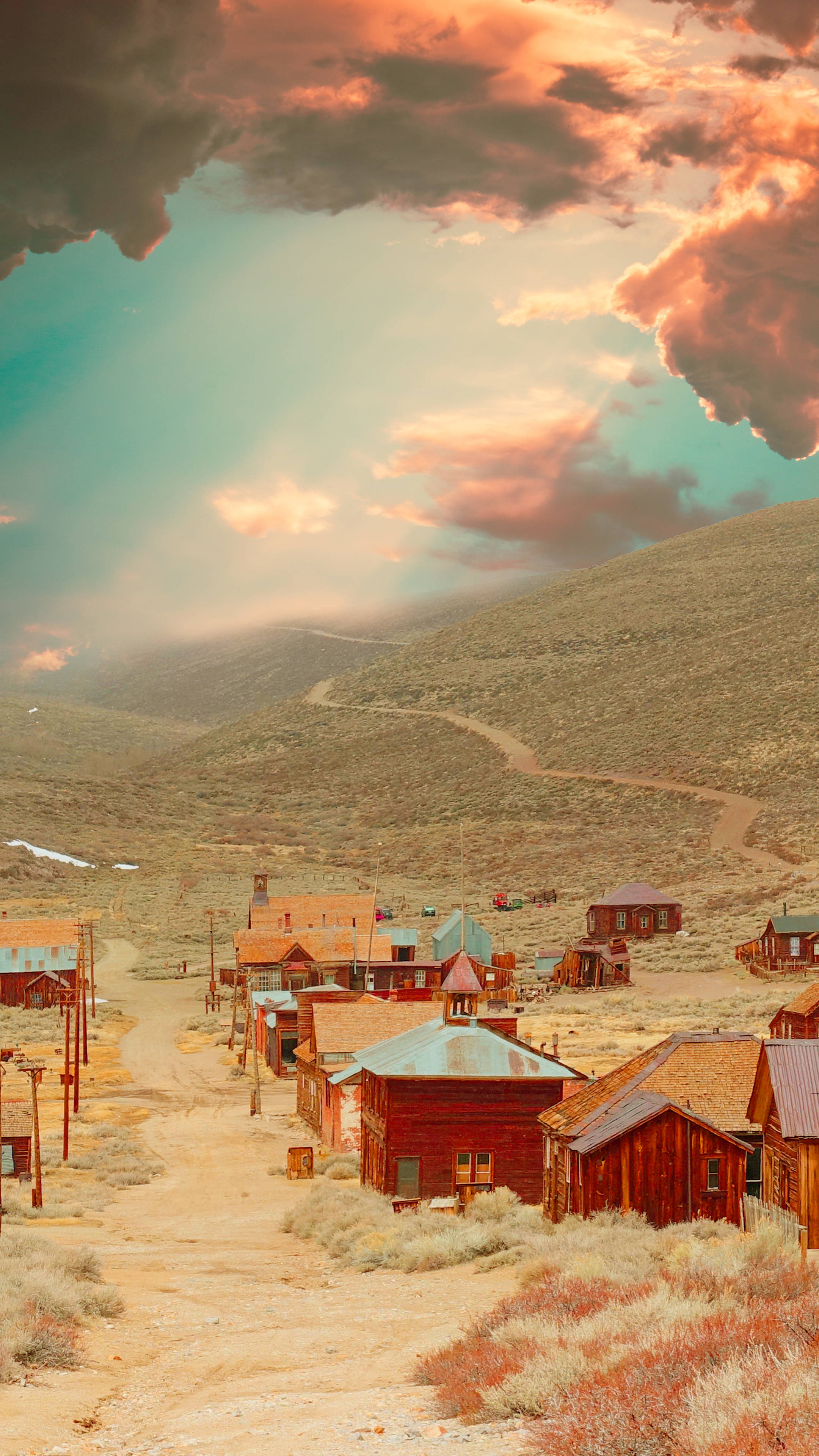 dusty desert ghost town, wooden buildings, dramatic sunset sky, 4K Phone Wallpaper