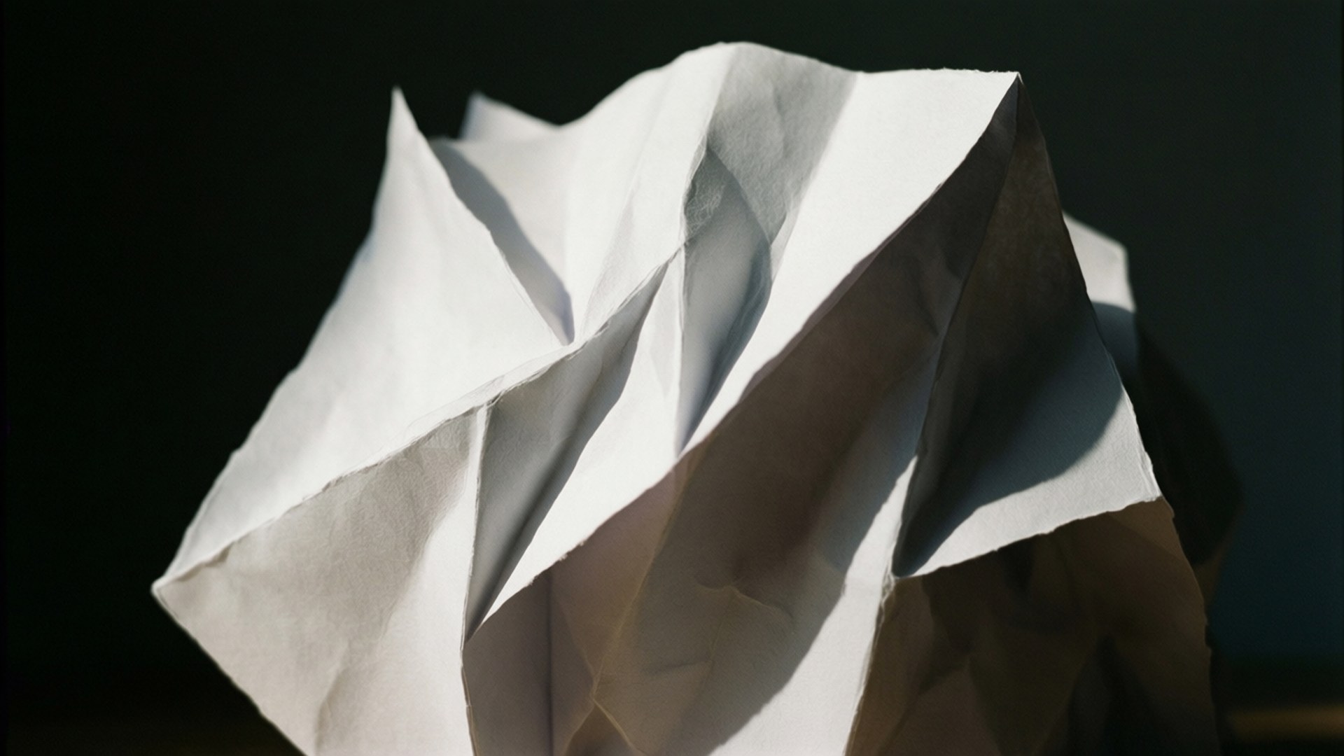 folded paper sculpture, crumpled white paper ball, dramatic lighting, Full HD Desktop Wallpaper
