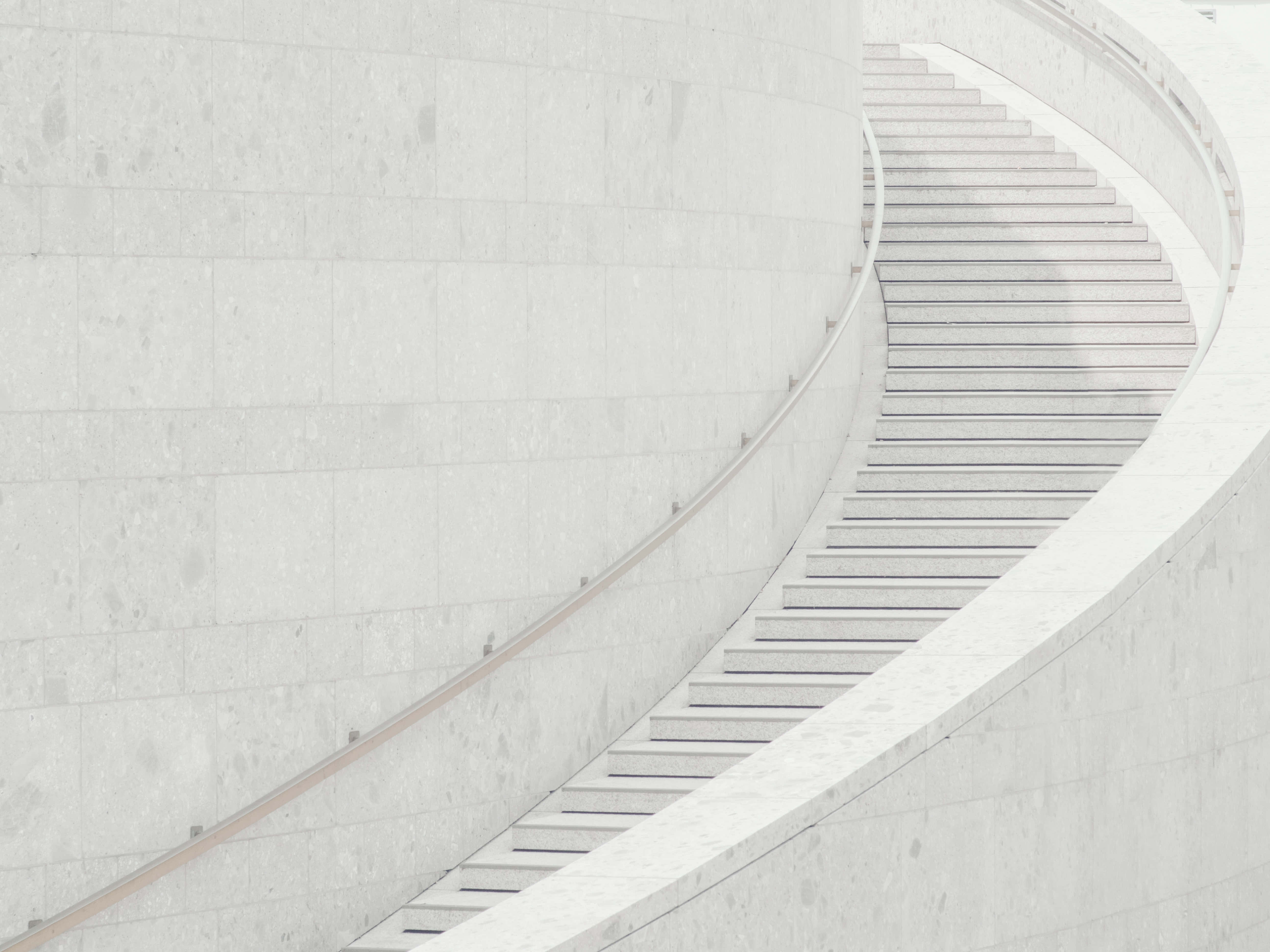 Pure White Steps, minimalist curved staircase, smooth white stone, 5K Desktop Wallpaper