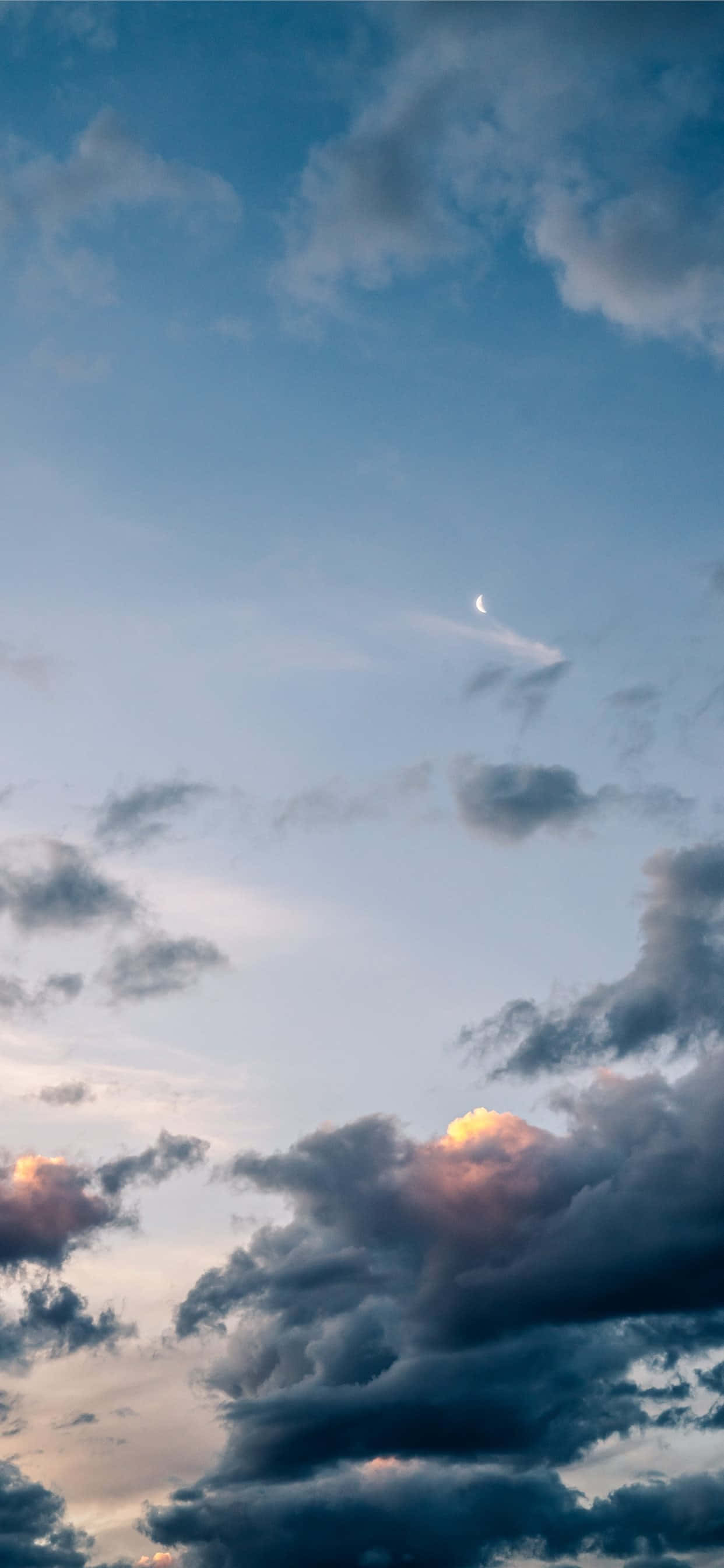 twilight sky, soft pink and blue hues, scattered clouds, 2K Phone Wallpaper