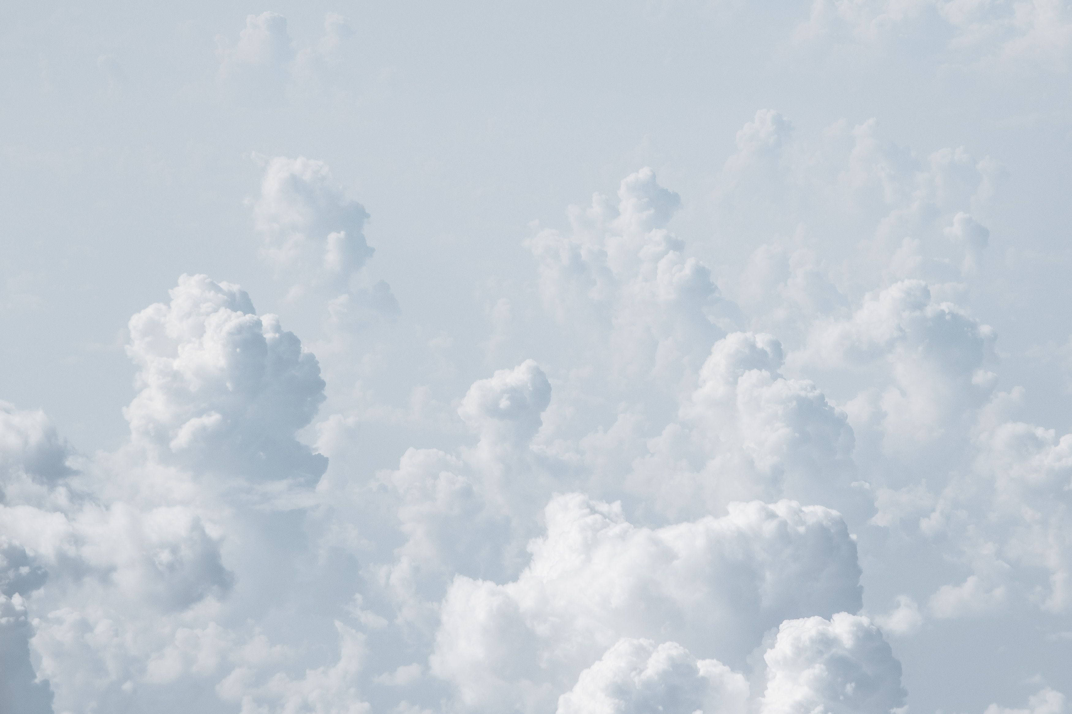 cool white clouds, vast fluffy white clouds, pale blue sky, 2K Desktop Wallpaper