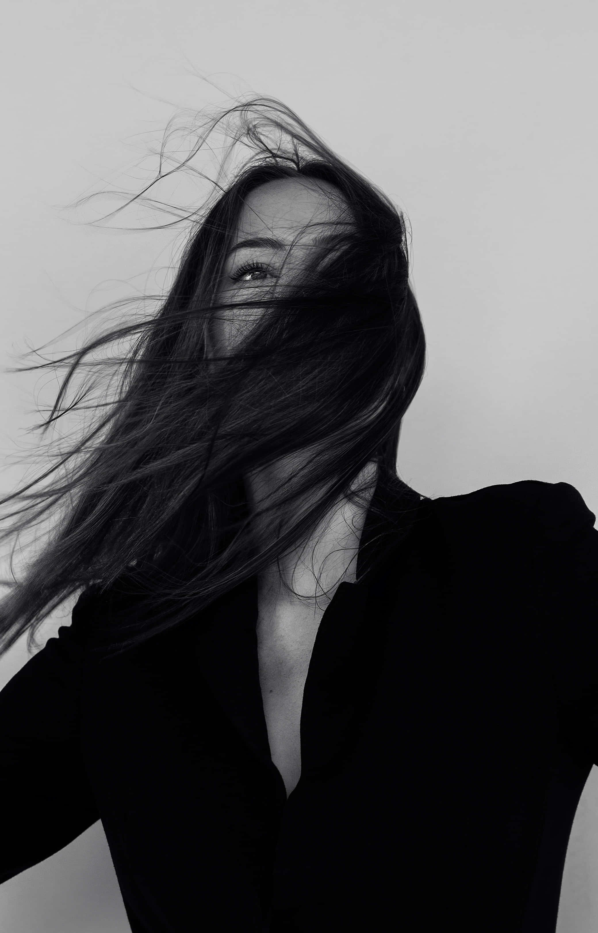 White Girl, hair billowing in the wind, black and white portrait, 2K Phone Wallpaper