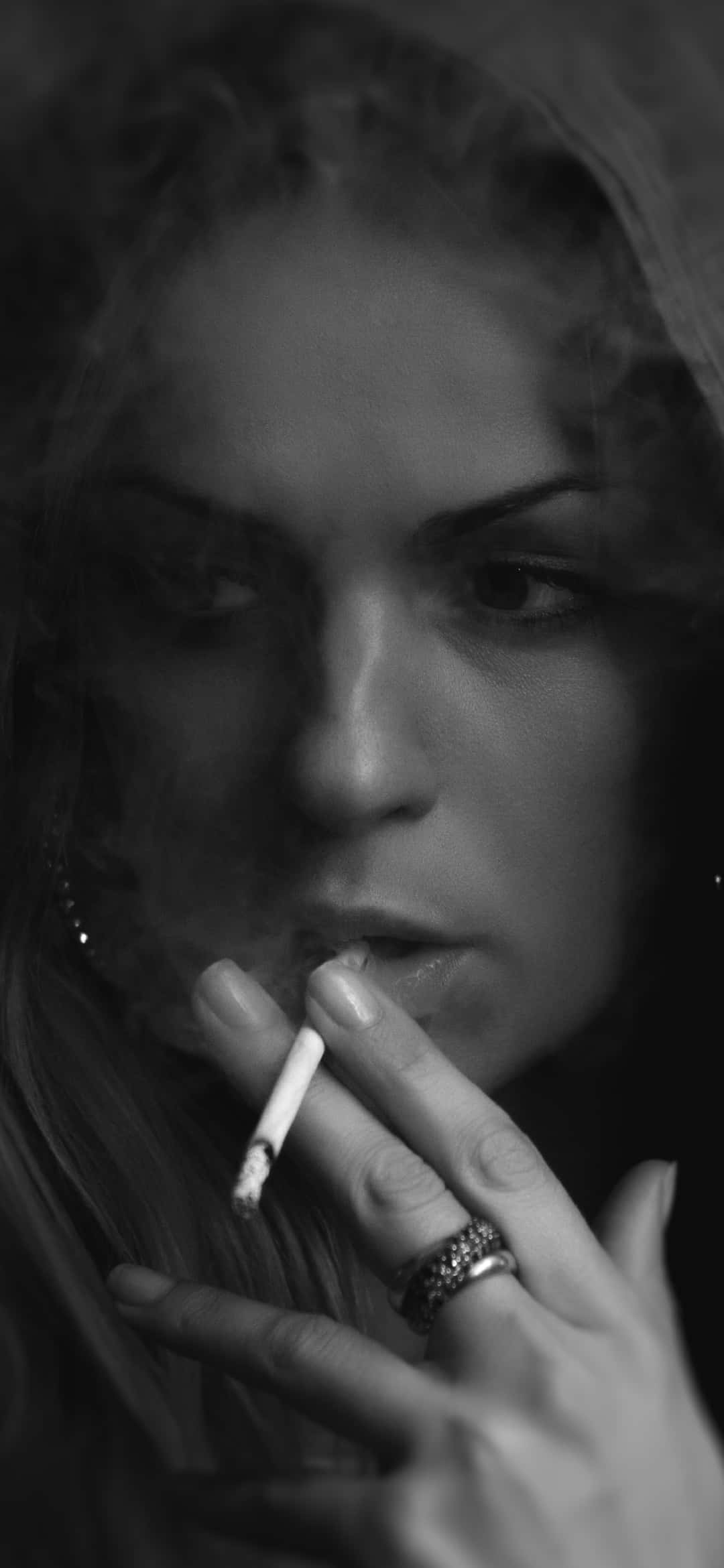black and white portrait, woman smoking a cigarette, smoke swirling around her face, Full HD Phone Wallpaper