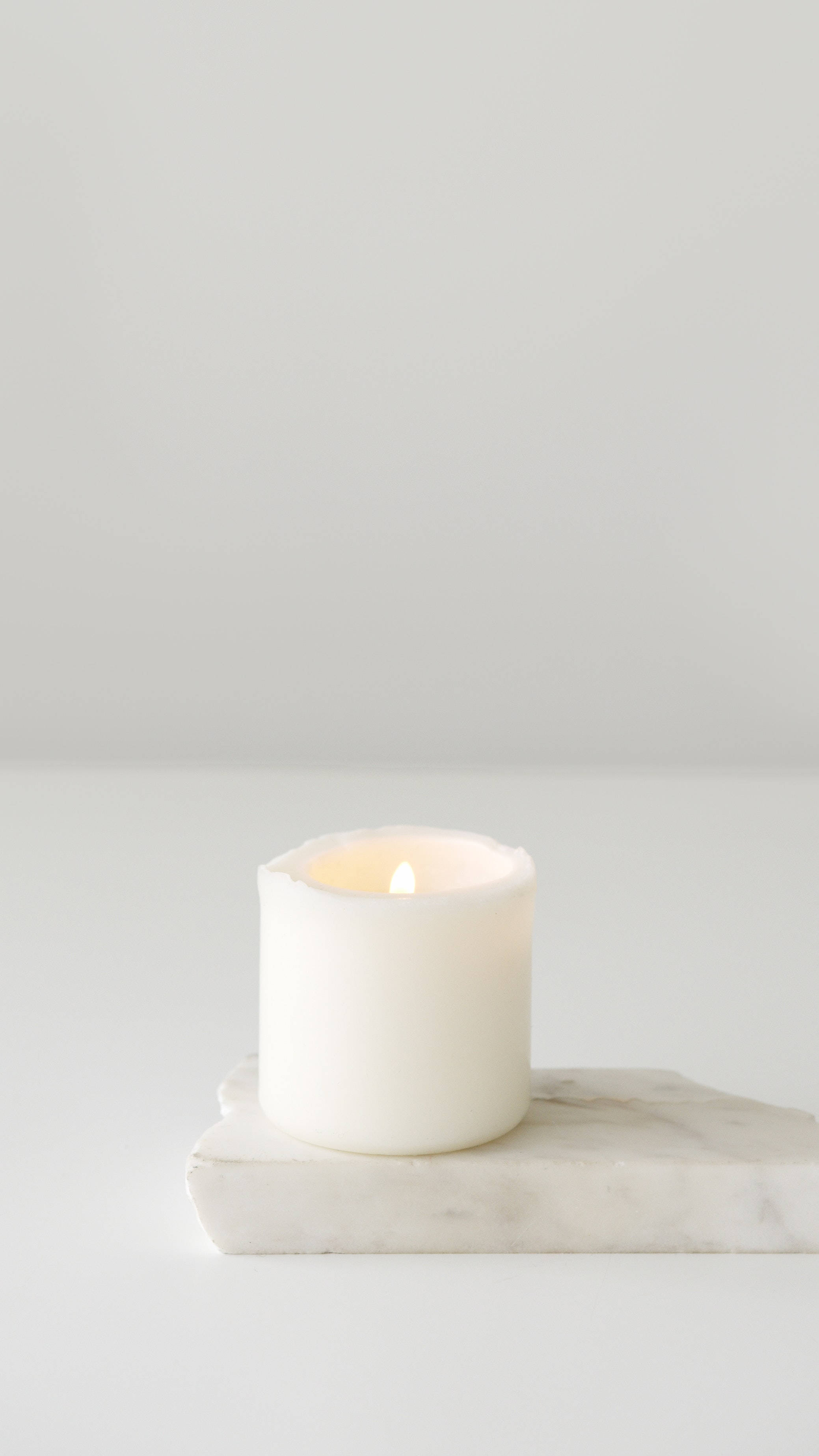 Pure White Candle, marble slab, minimalist white background, 2K Phone Wallpaper