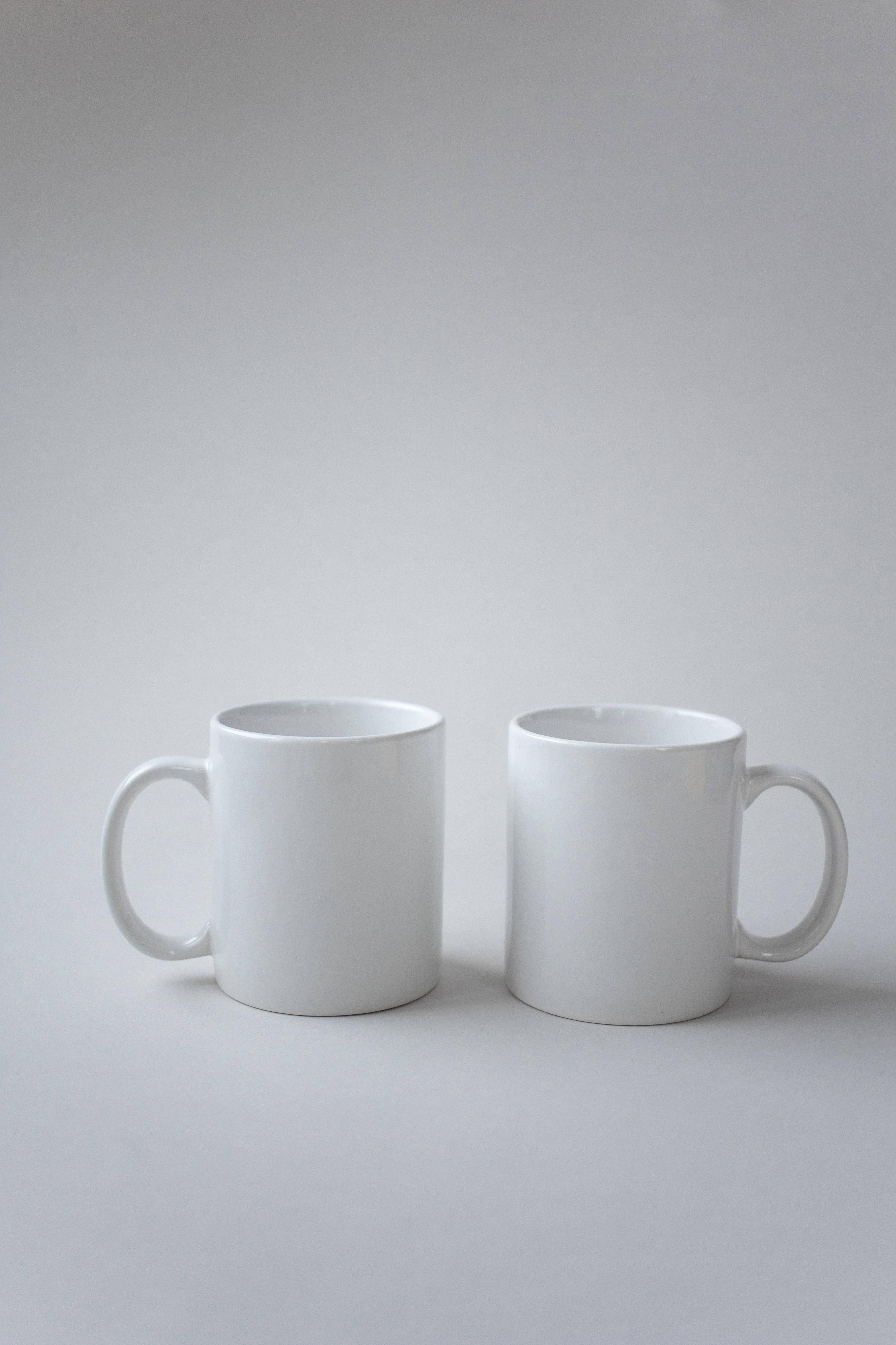 pure white mugs, ceramic mugs, neutral gray surface, 5K Phone Wallpaper