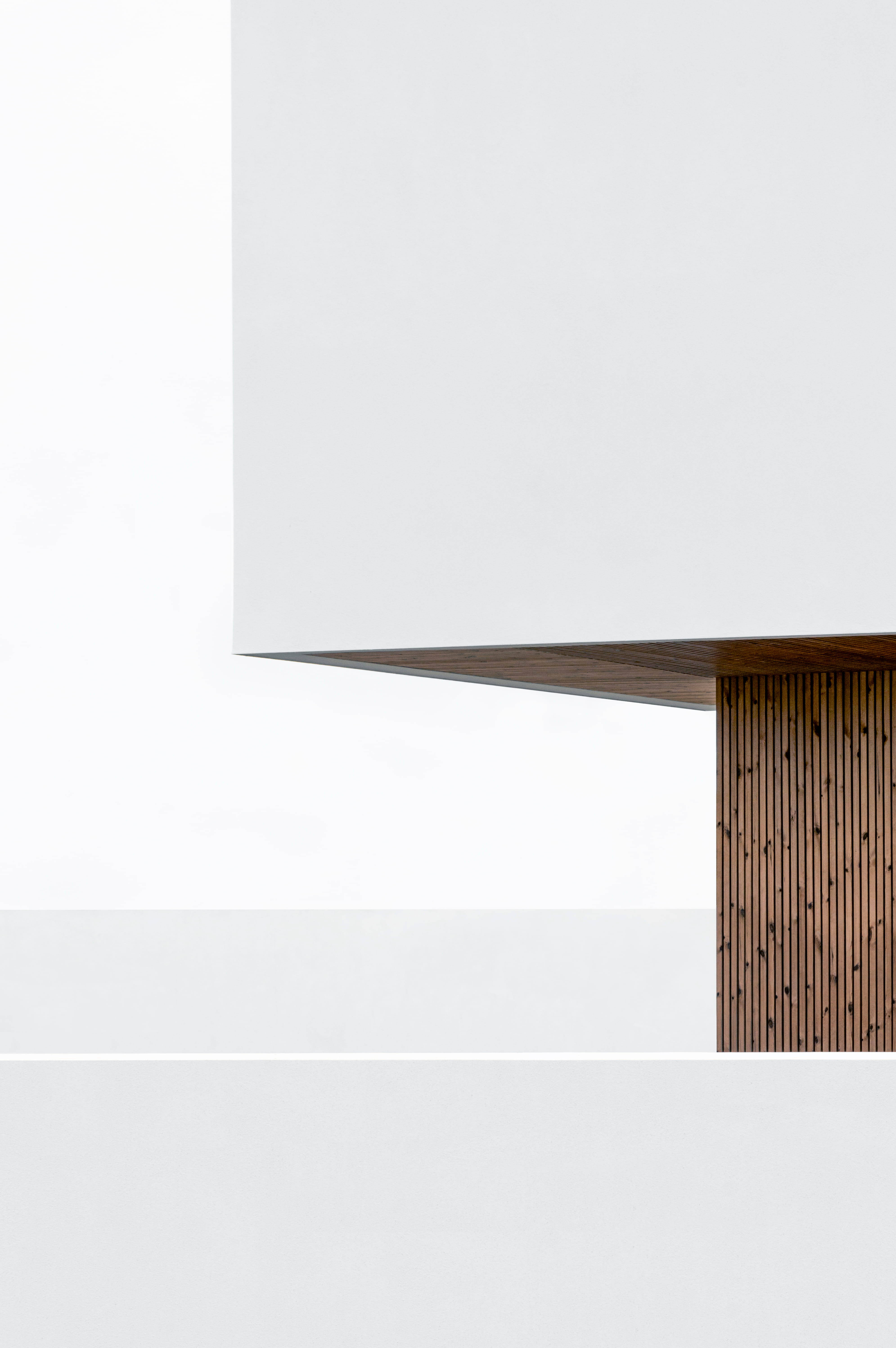 white minimalist architecture, dark wood slatted panel, stark white wall, 5K Phone Wallpaper