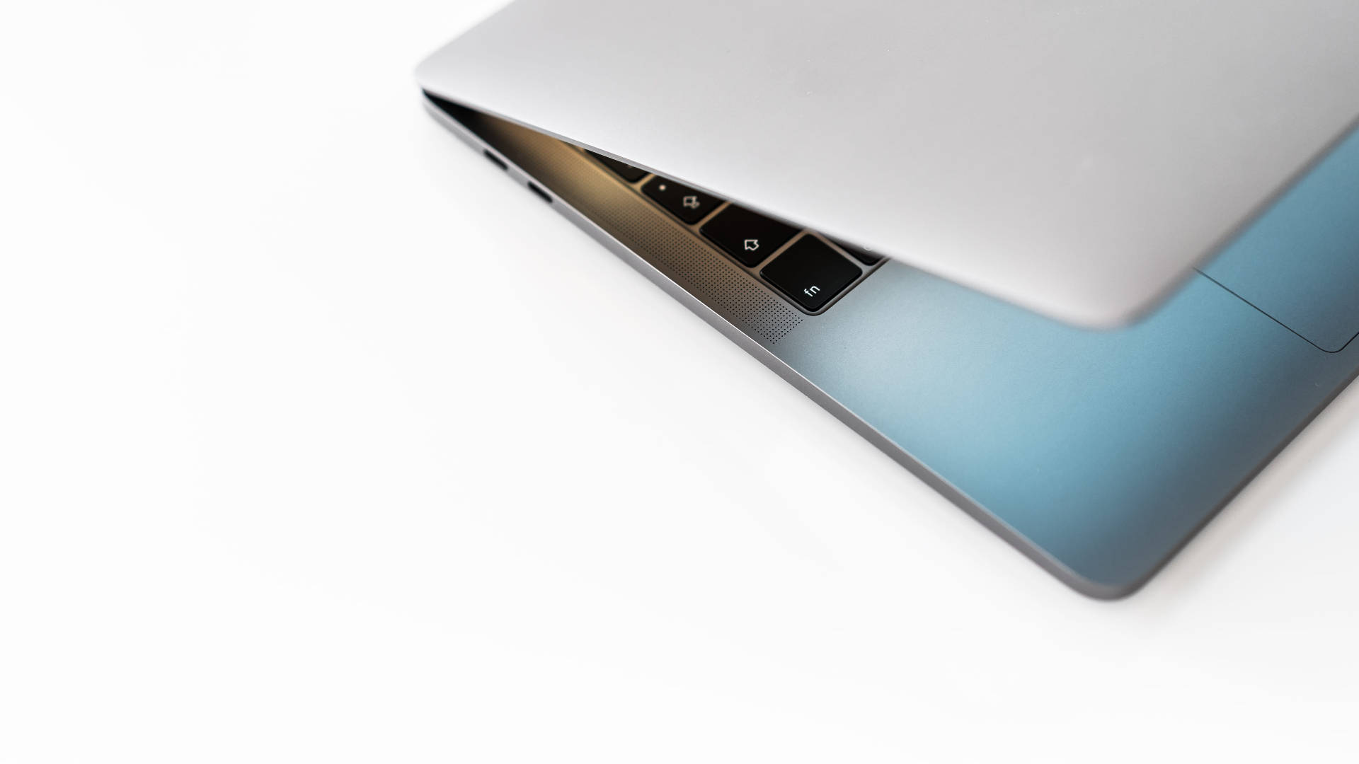 white minimalist, sleek silver laptop, blue gradient base, Full HD Desktop Wallpaper