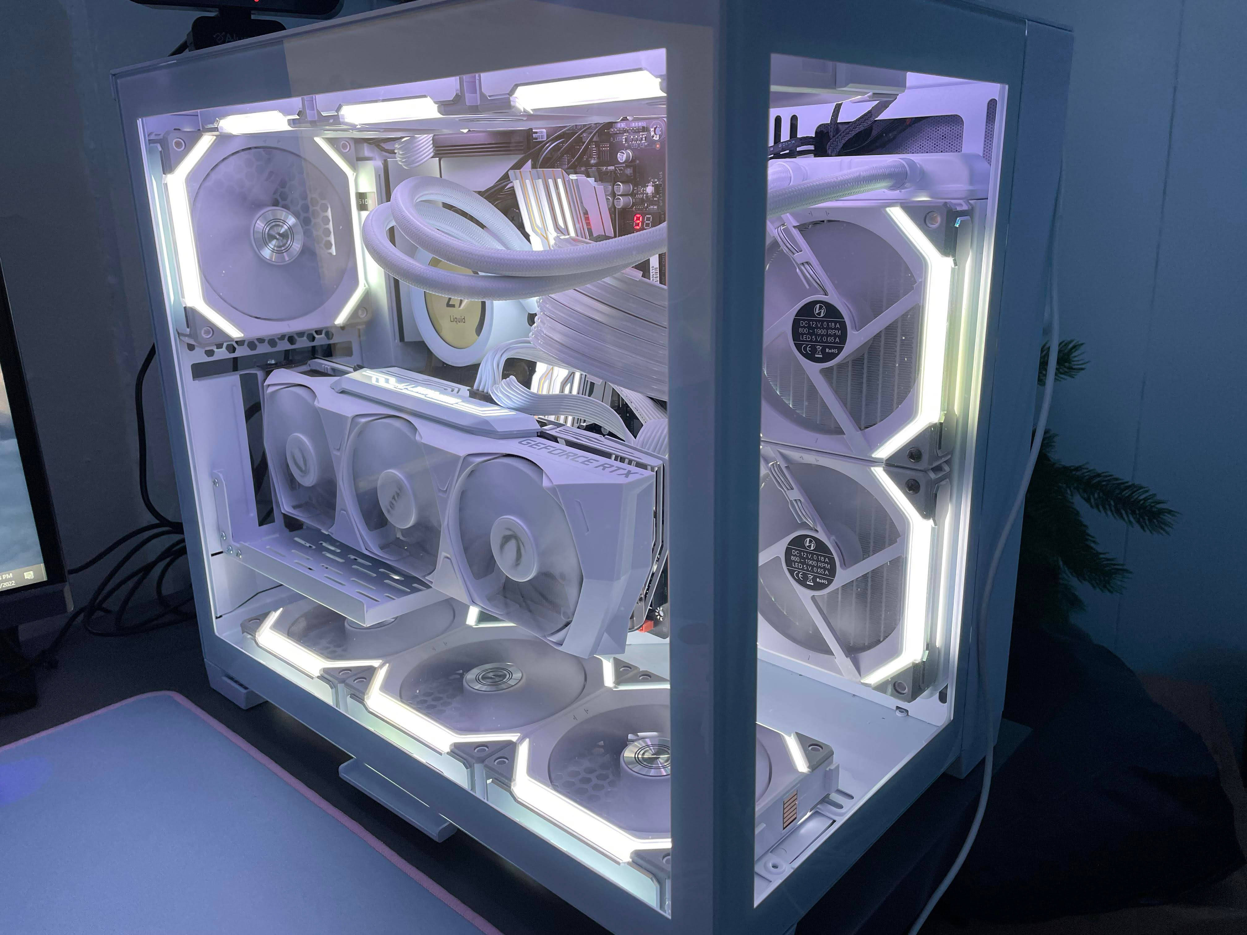 white computer case, glowing internal components, fans illuminated by soft blue light, 4K Desktop Wallpaper