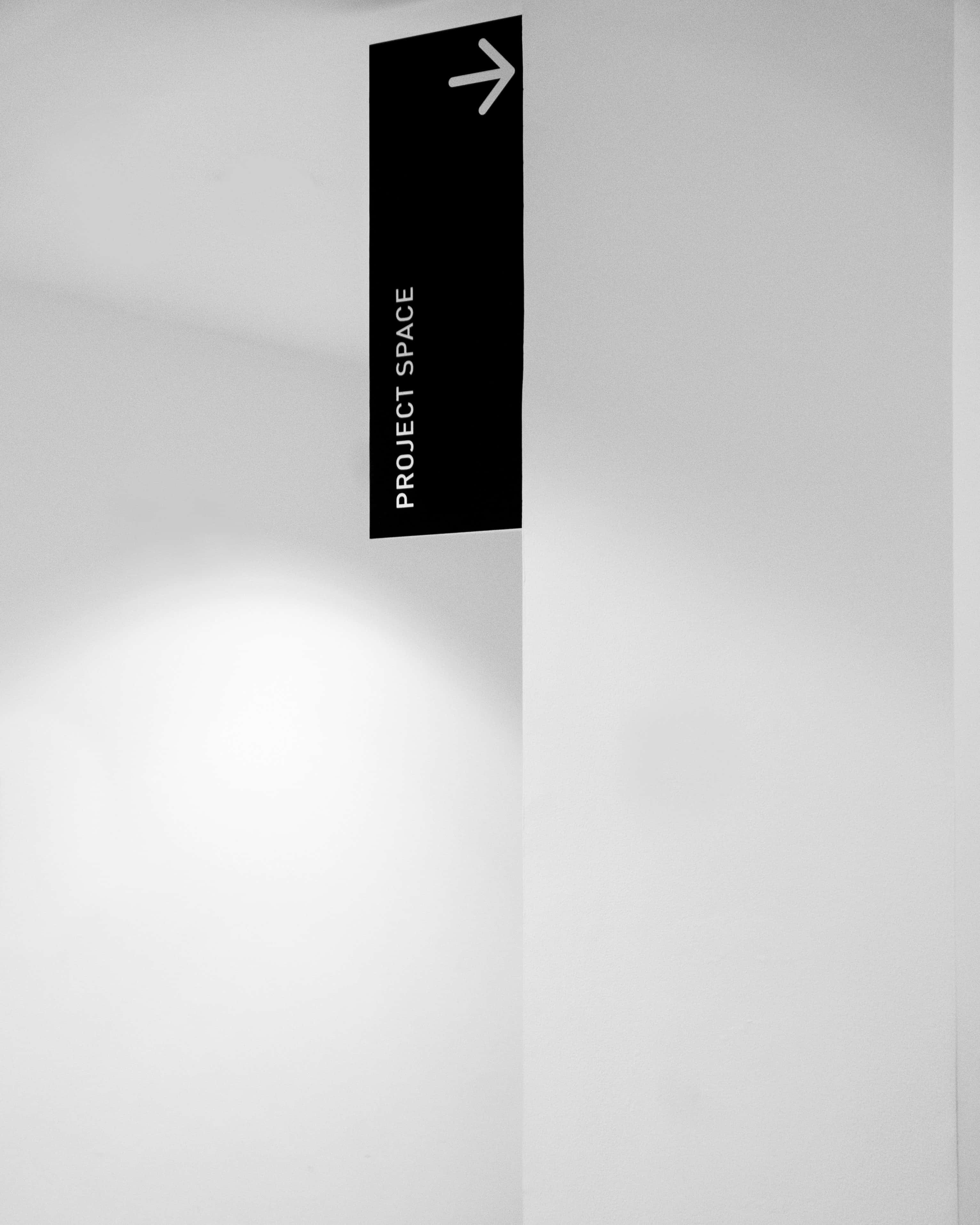 black sign, project space, arrow pointing right, 2K Phone Wallpaper