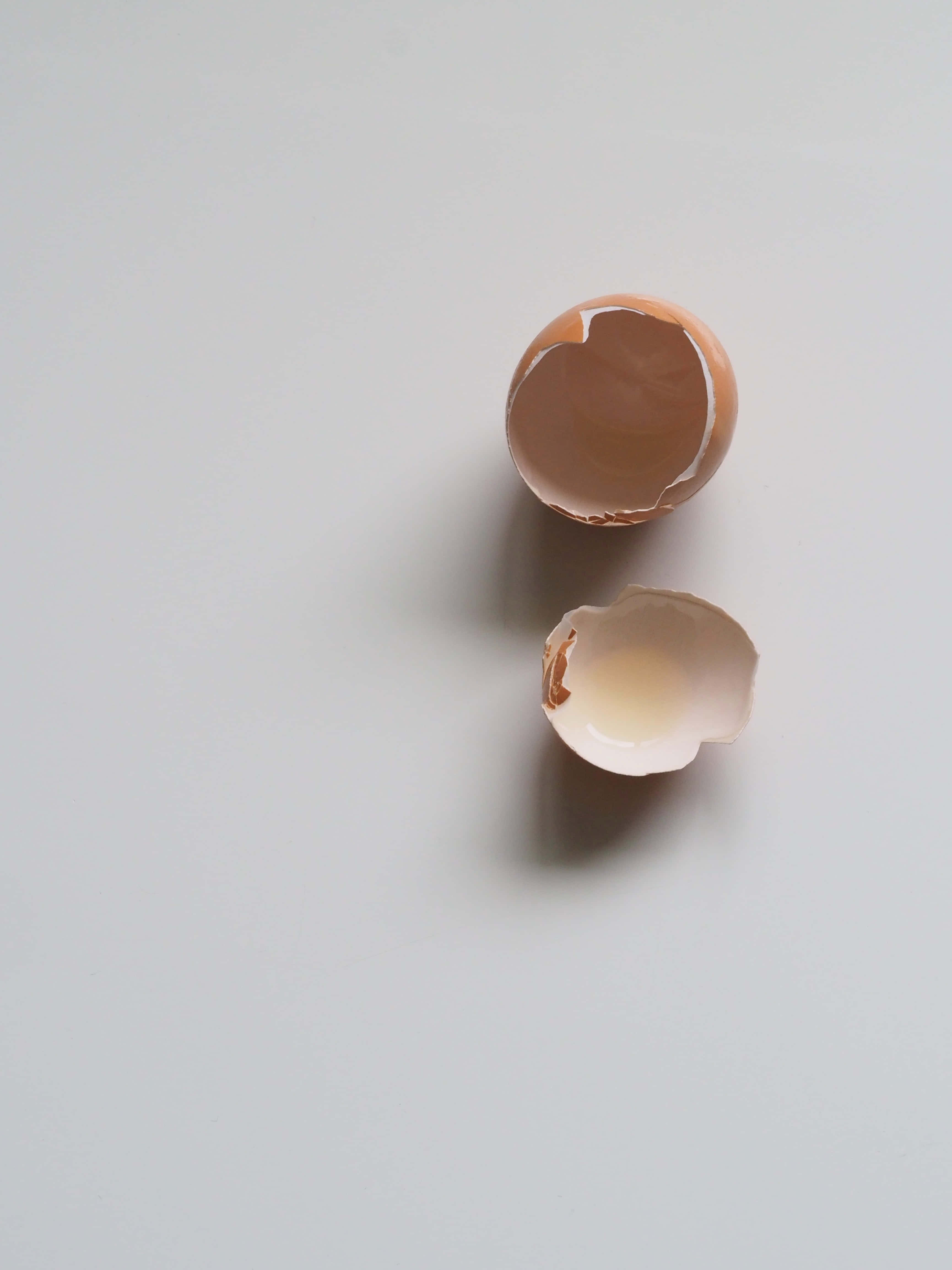 empty egg shell, brown eggshells, plain white surface, 4K Phone Wallpaper