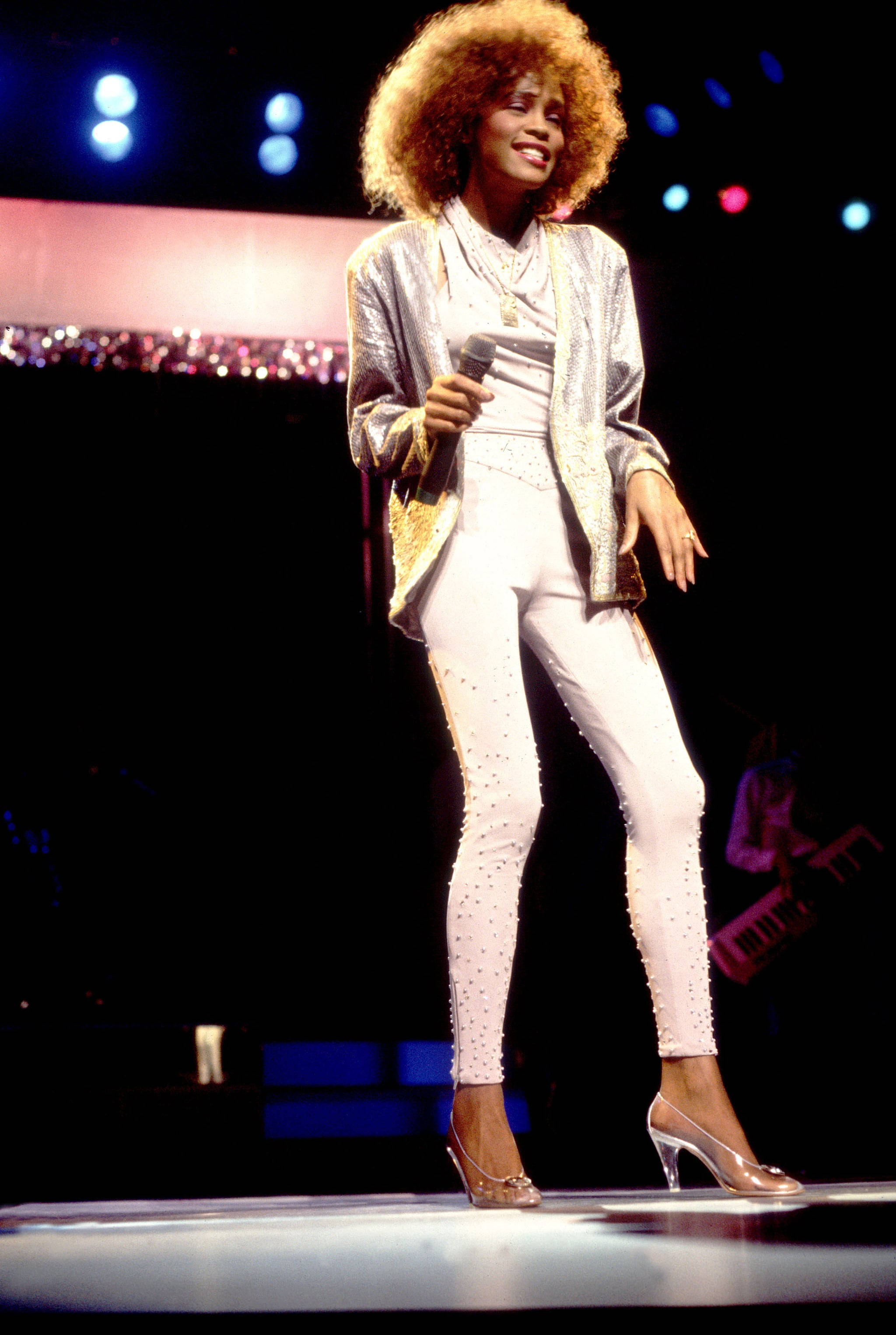 Whitney Houston, voluminous afro, sparkling silver jacket, 2K Phone Wallpaper