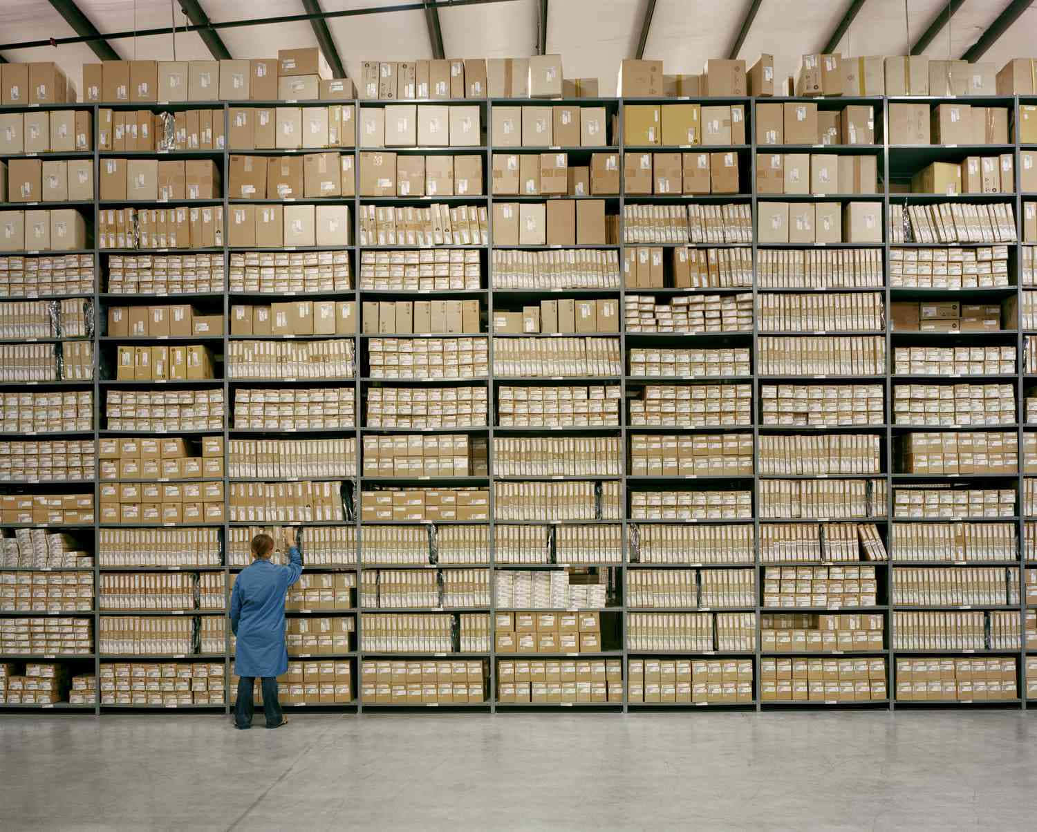 blue coat, towering industrial shelves, vast warehouse, HD Desktop Wallpaper