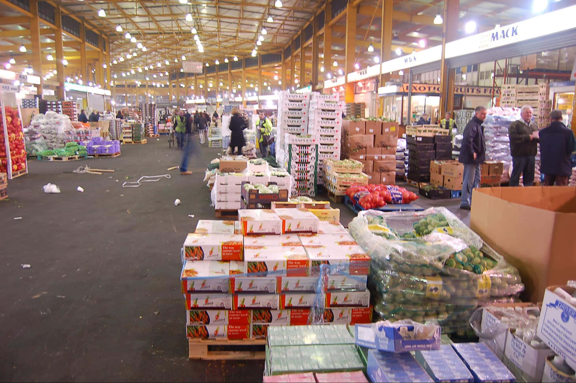 indoor wholesale market, stacked crates, fresh produce, Full HD Desktop Wallpaper
