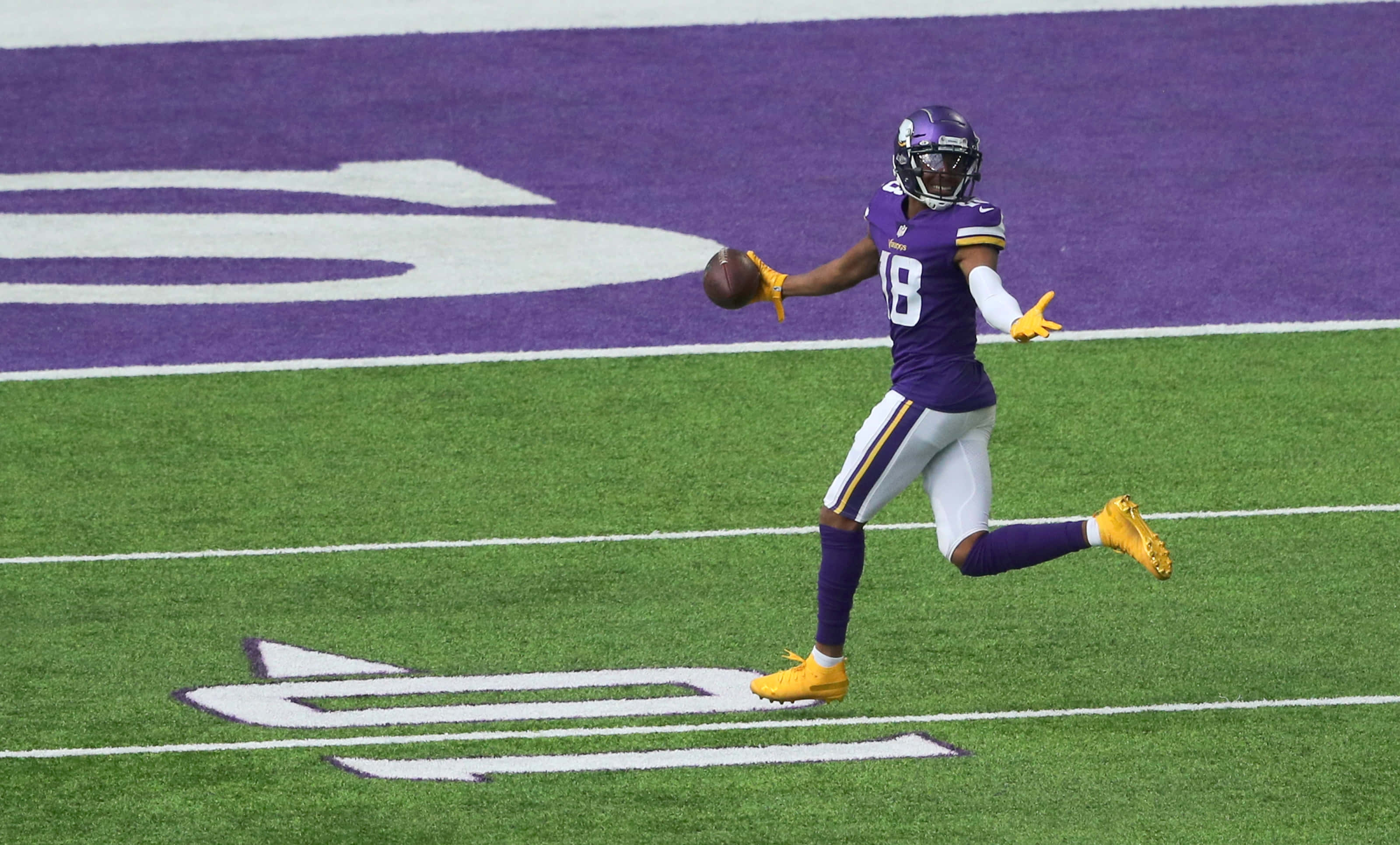 purple and gold uniform, vibrant green field, white lines, 2K Desktop Wallpaper