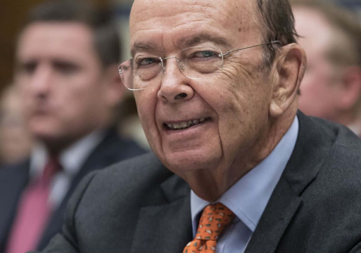 Wilbur Ross, gray suit, orange patterned tie, SD Desktop Wallpaper