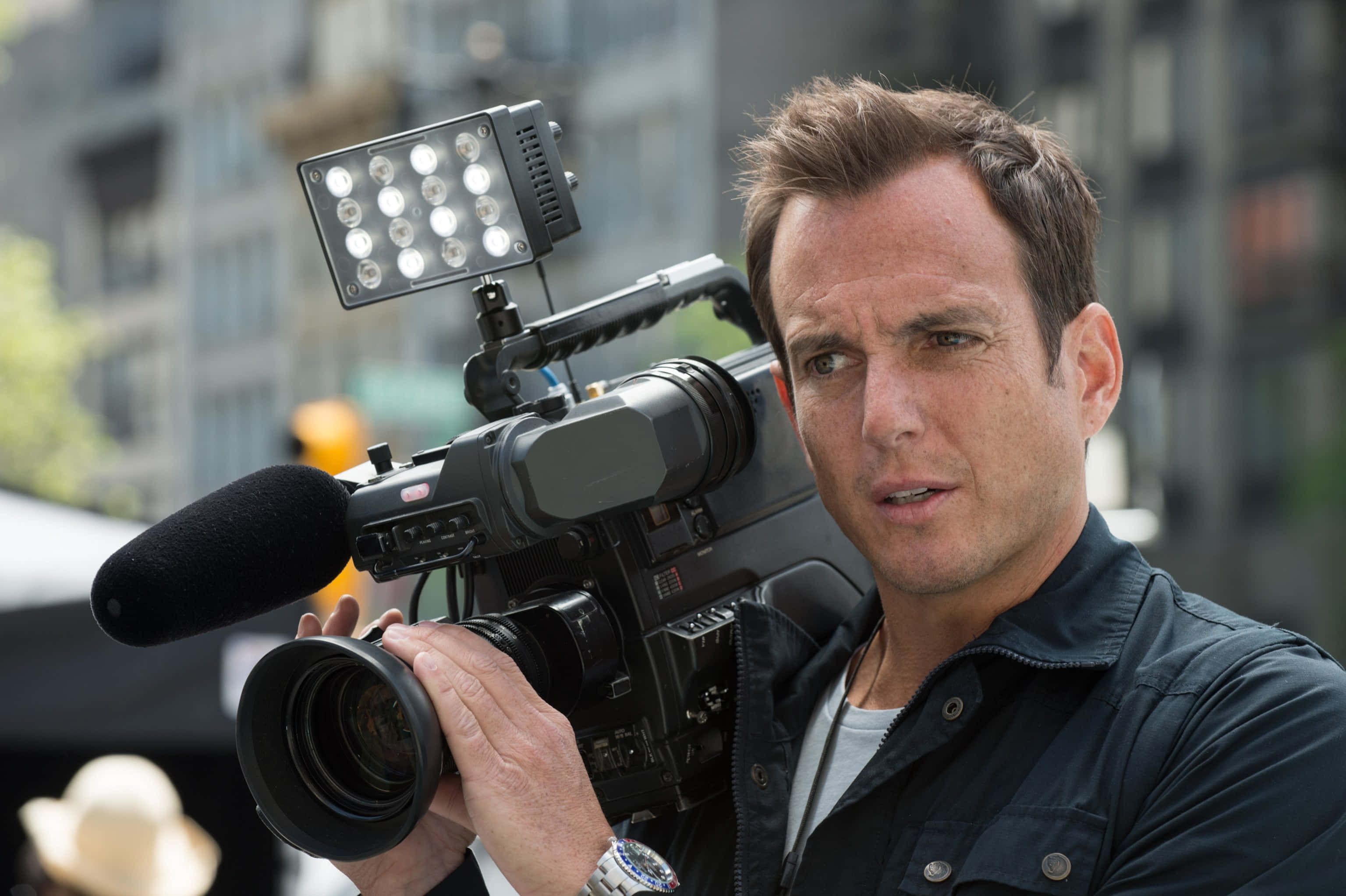 Will Arnett, blue background, professional video camera, 2K Desktop Wallpaper