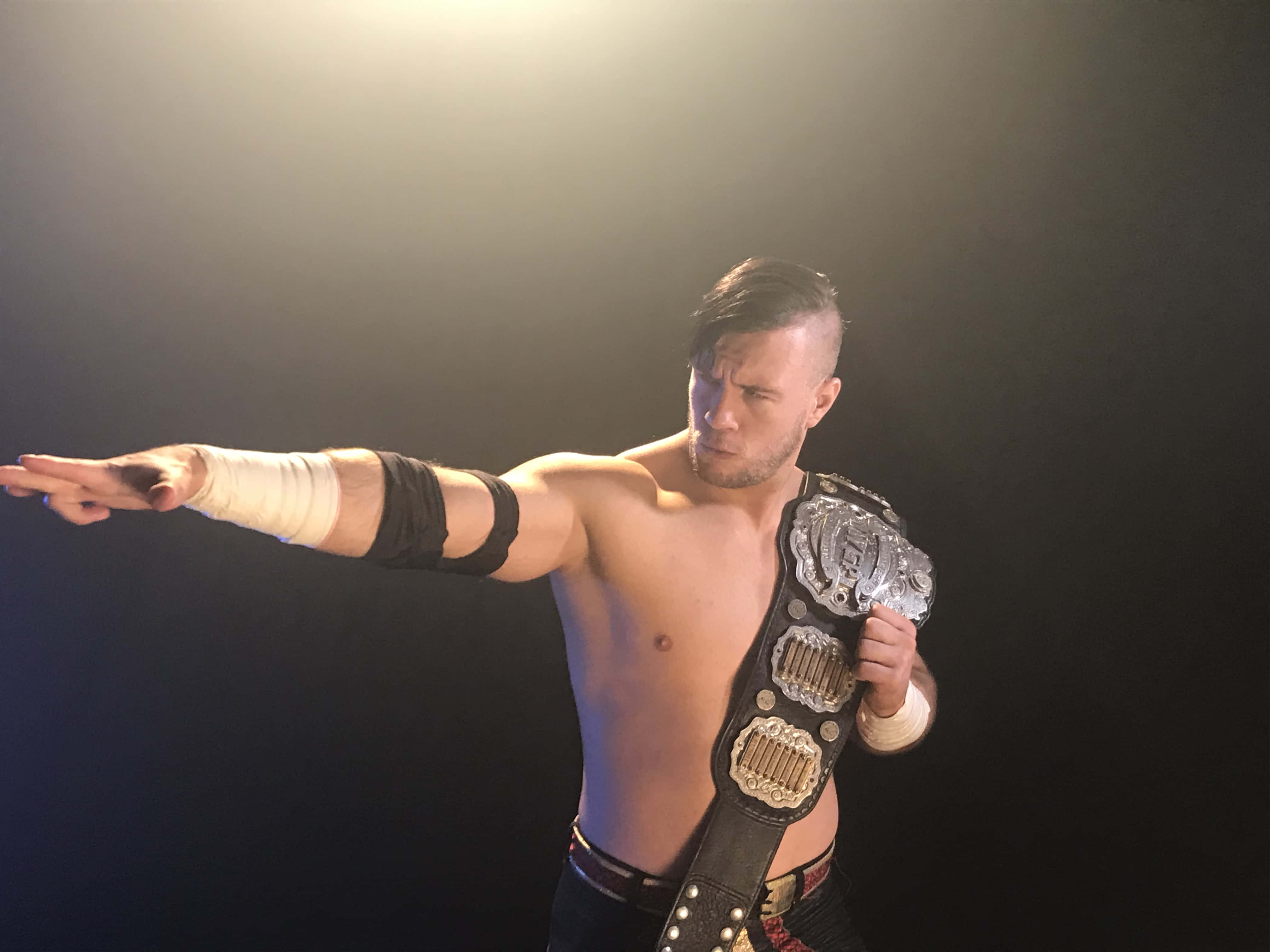 Will Ospreay, championship belt, dramatic studio lighting, 4K Desktop Wallpaper