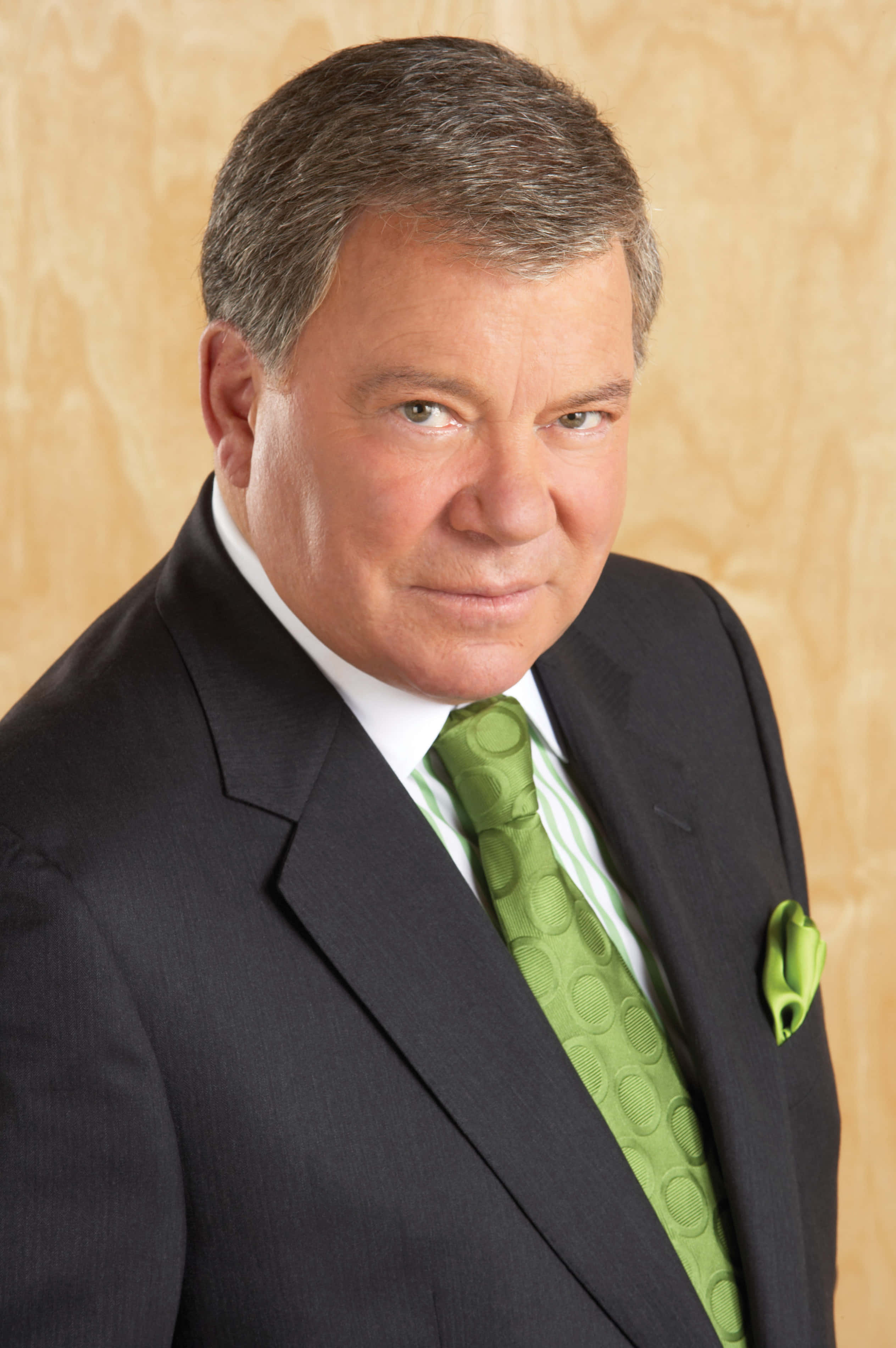 William Shatner, black suit, vibrant green tie, 2K Phone Wallpaper