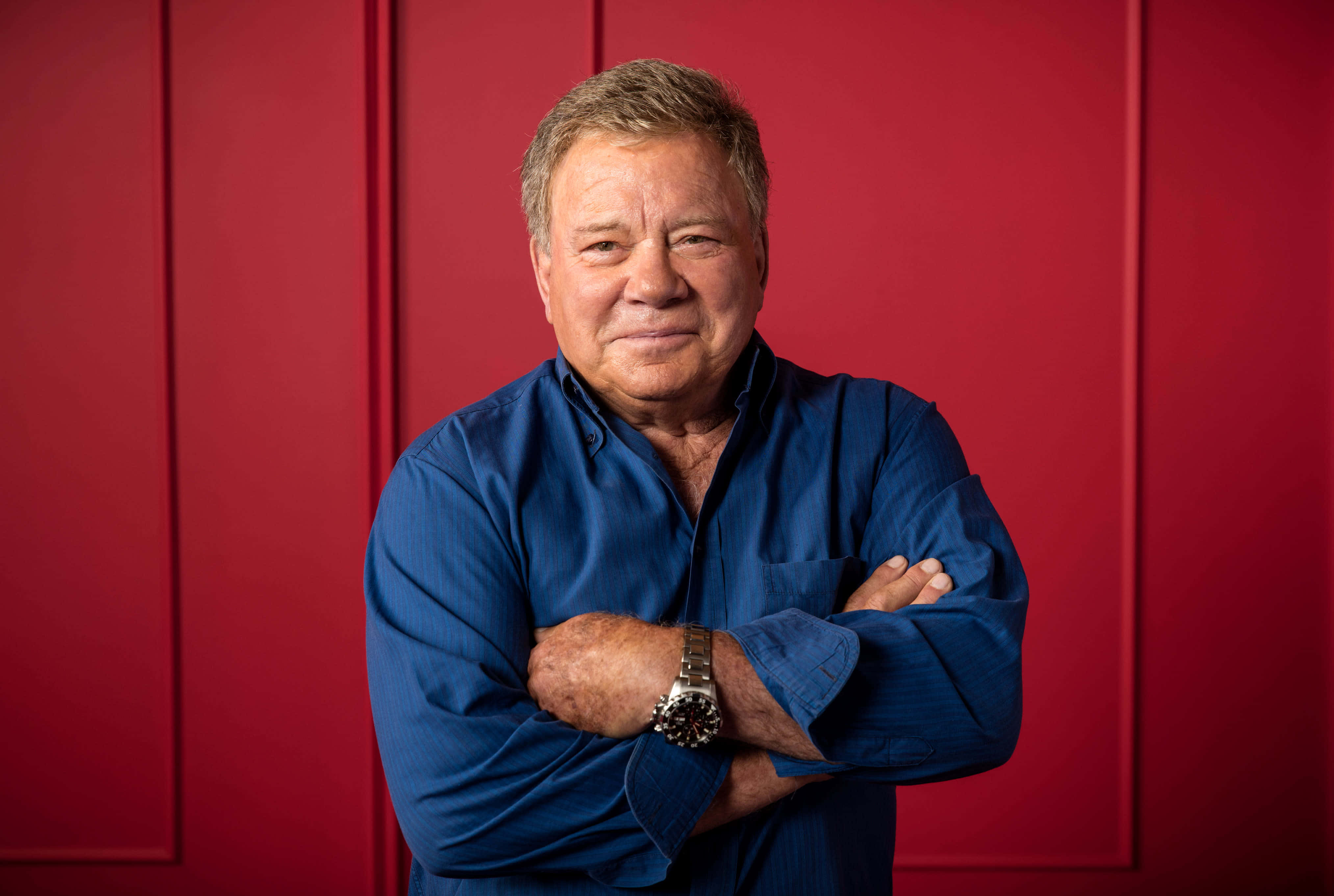 William Shatner, blue shirt, red paneled wall, 4K Desktop Wallpaper