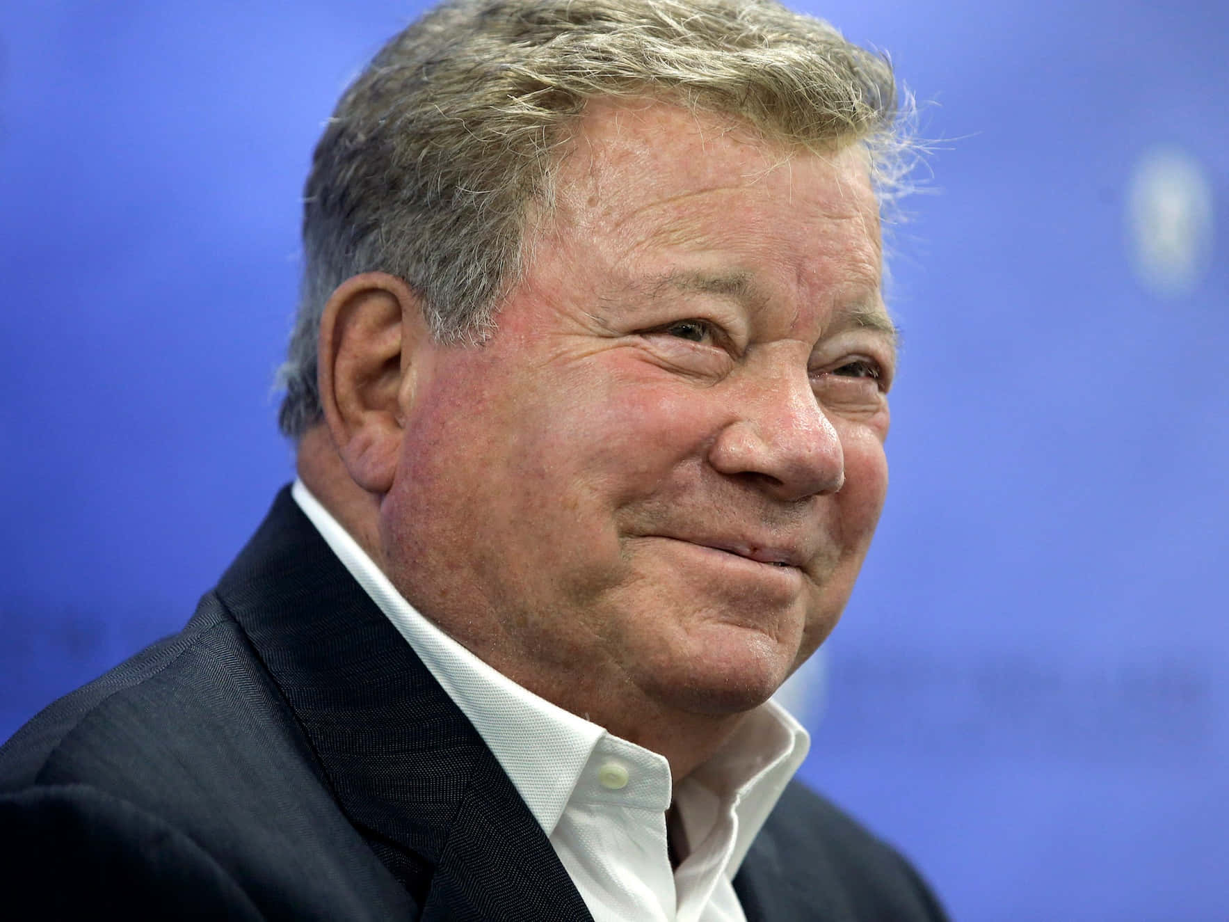 William Shatner, dark suit, solid blue background, HD Desktop Wallpaper