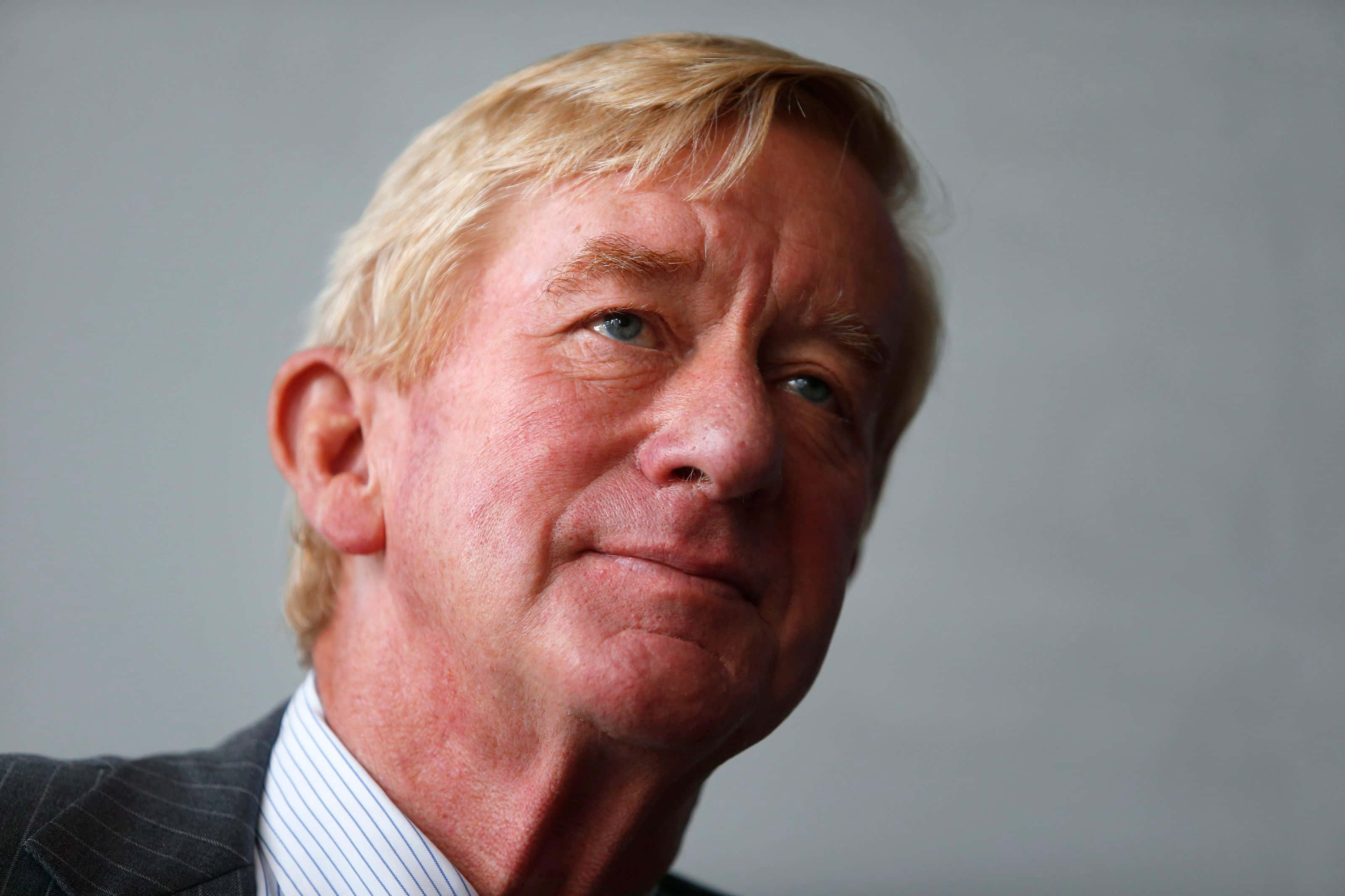 William Weld, blond-haired man, pinstripe suit, 2K Desktop Wallpaper
