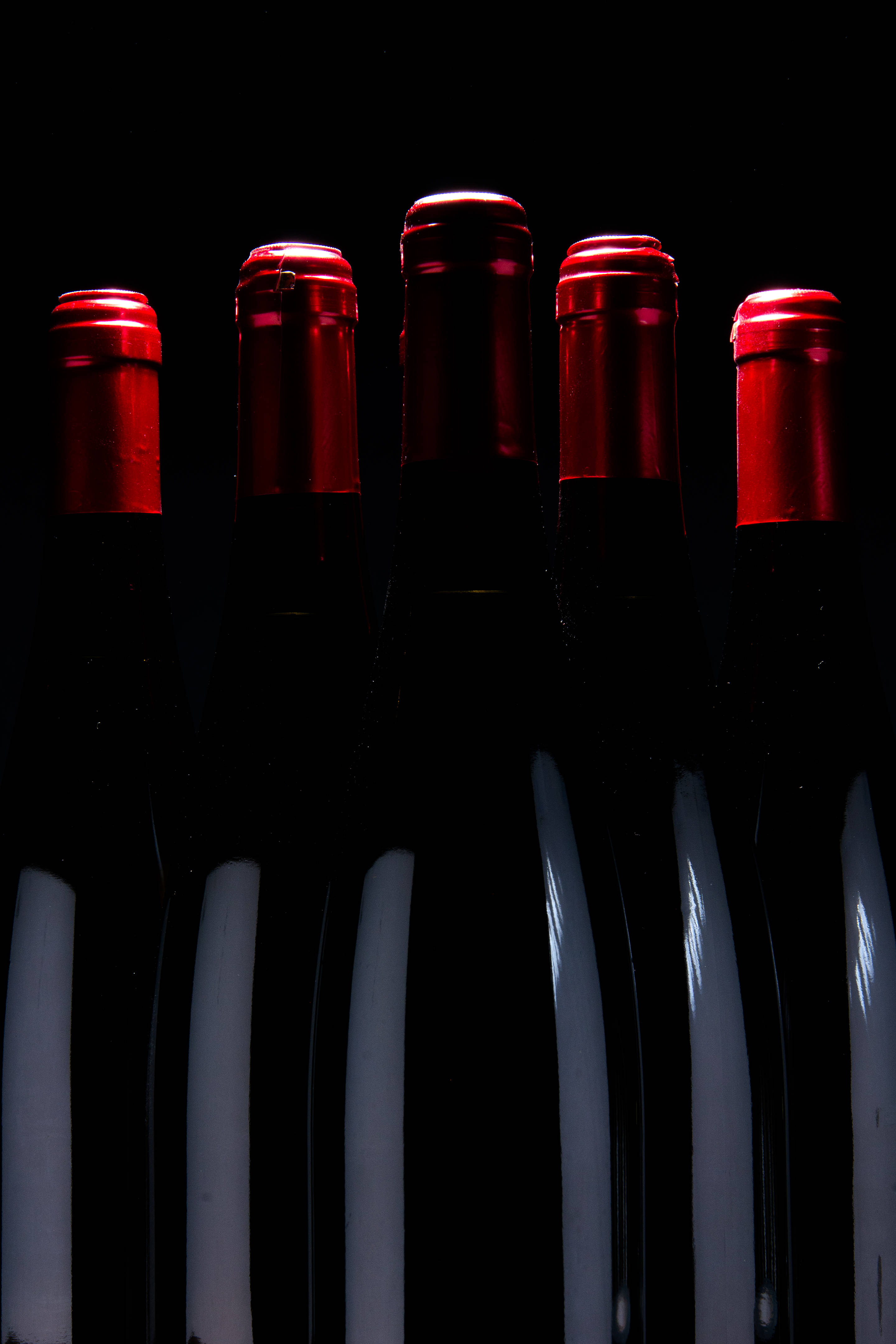 luxury wine bottles, dark wine bottles, glowing red foil caps, 4K Phone Wallpaper
